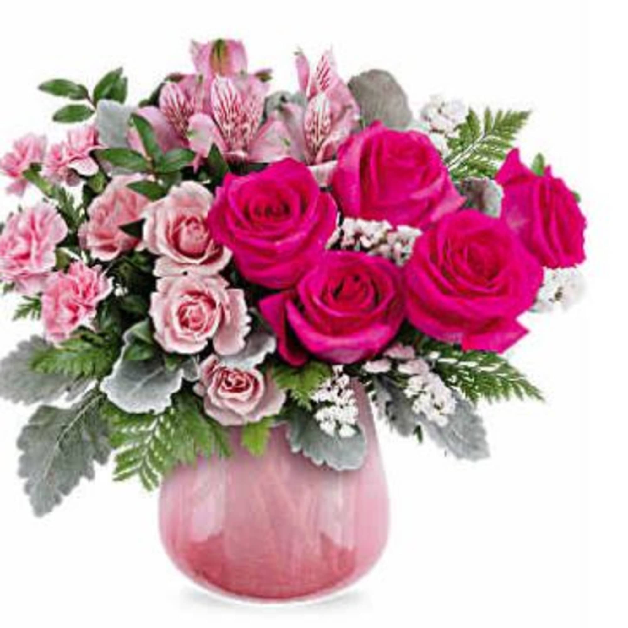 Pink roses and carnations in a pink glass vase