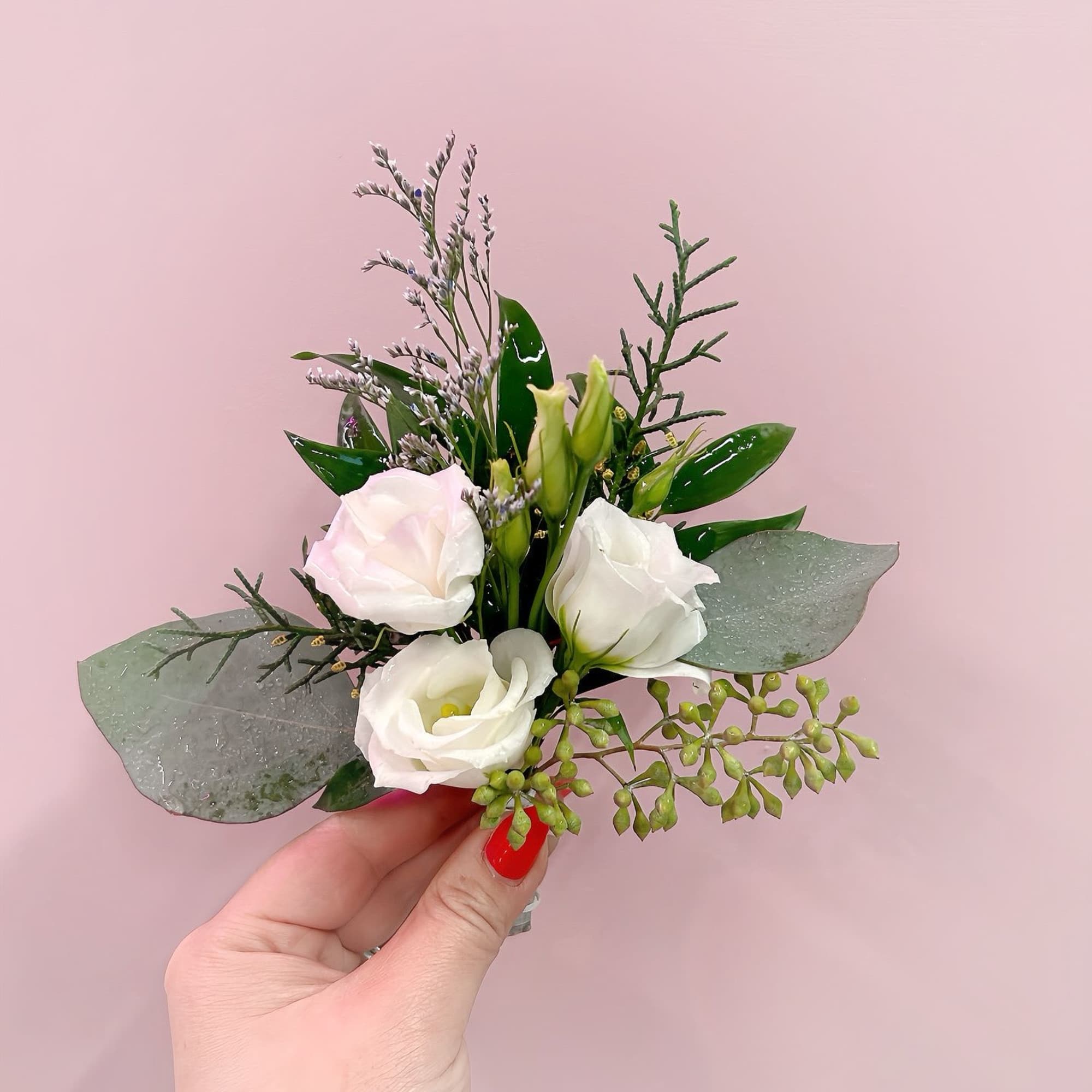 Small white floral bouquet with greenery and eucalyptus leaves