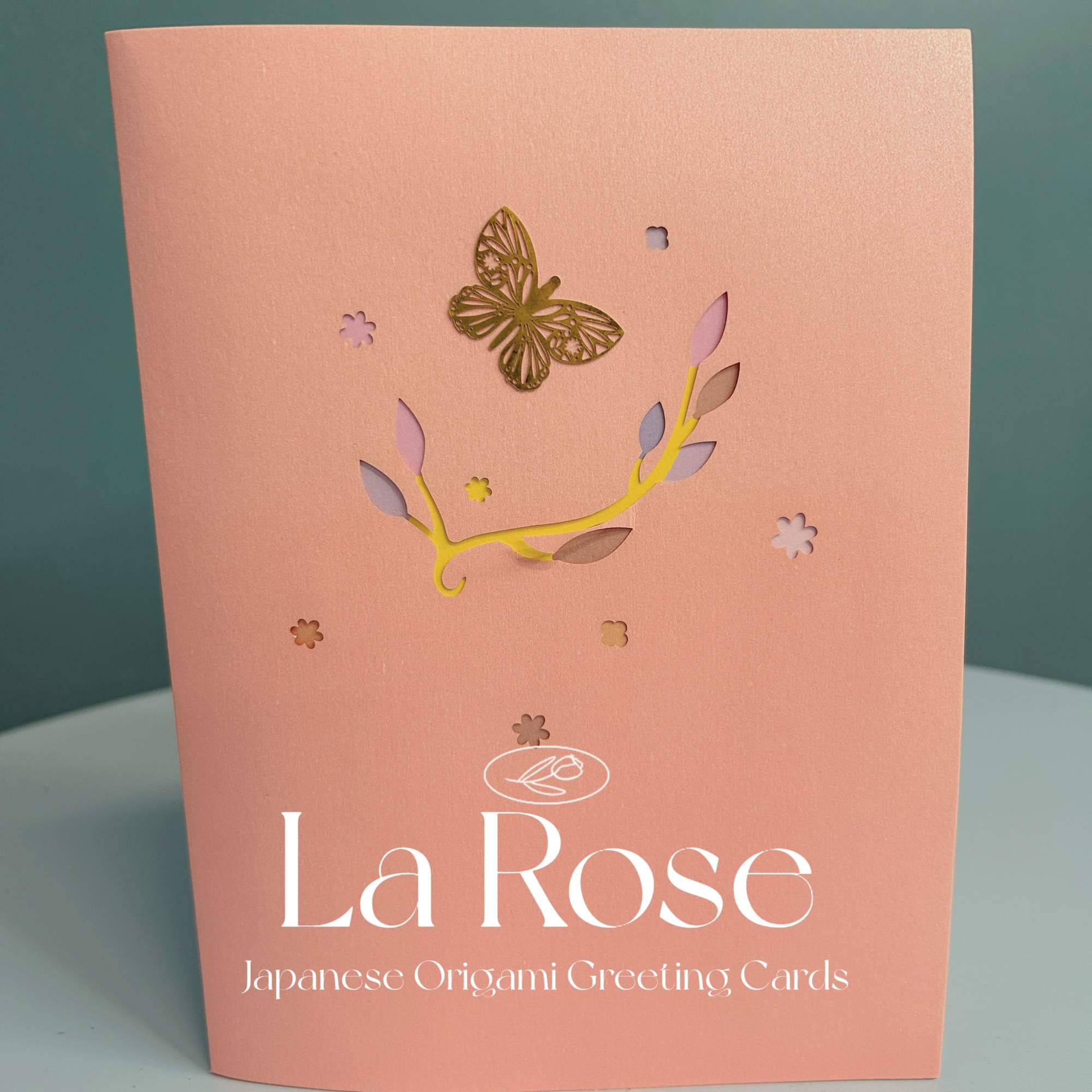 Pink greeting card package with butterfly and floral cutout design