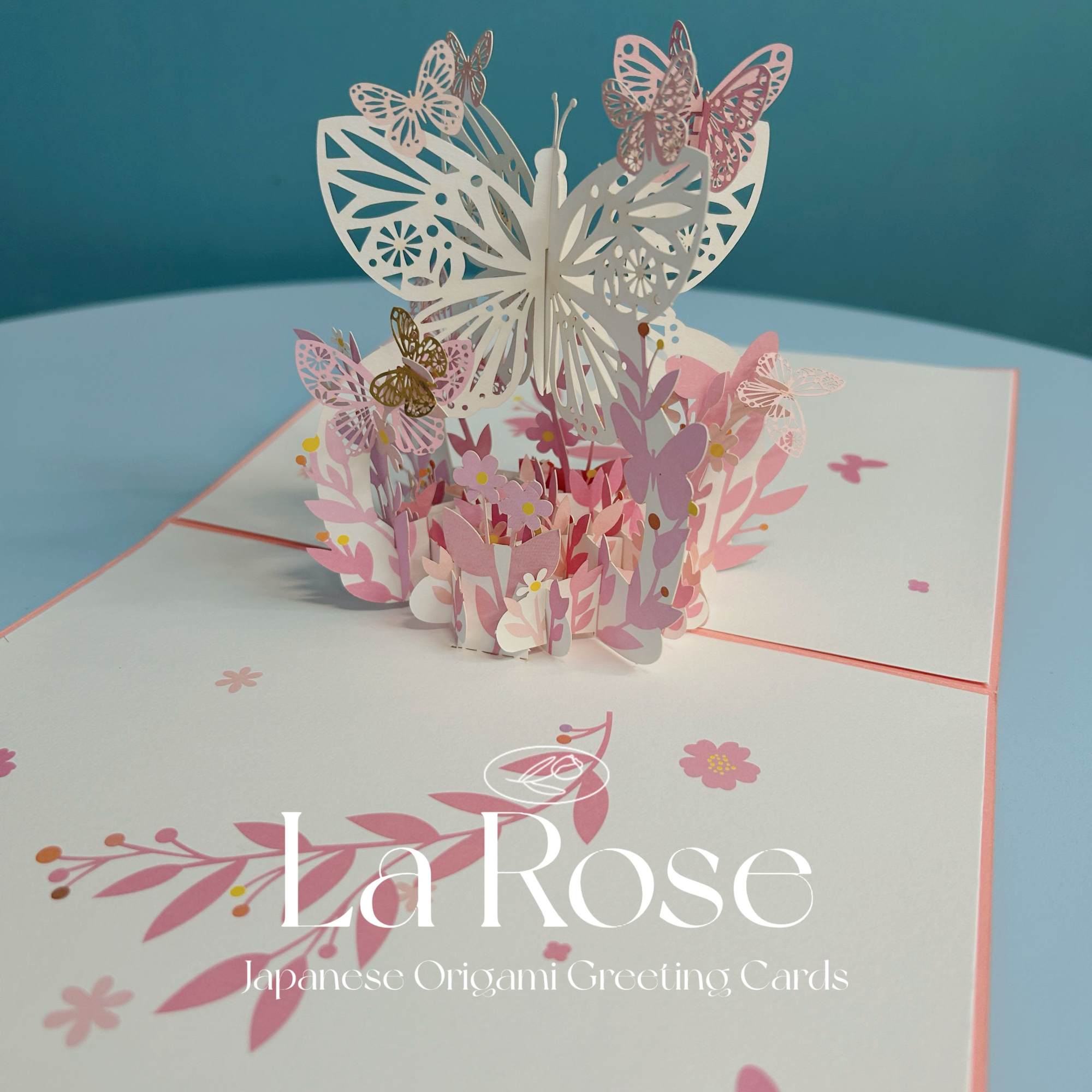Pop-up butterfly greeting card with pink floral accents