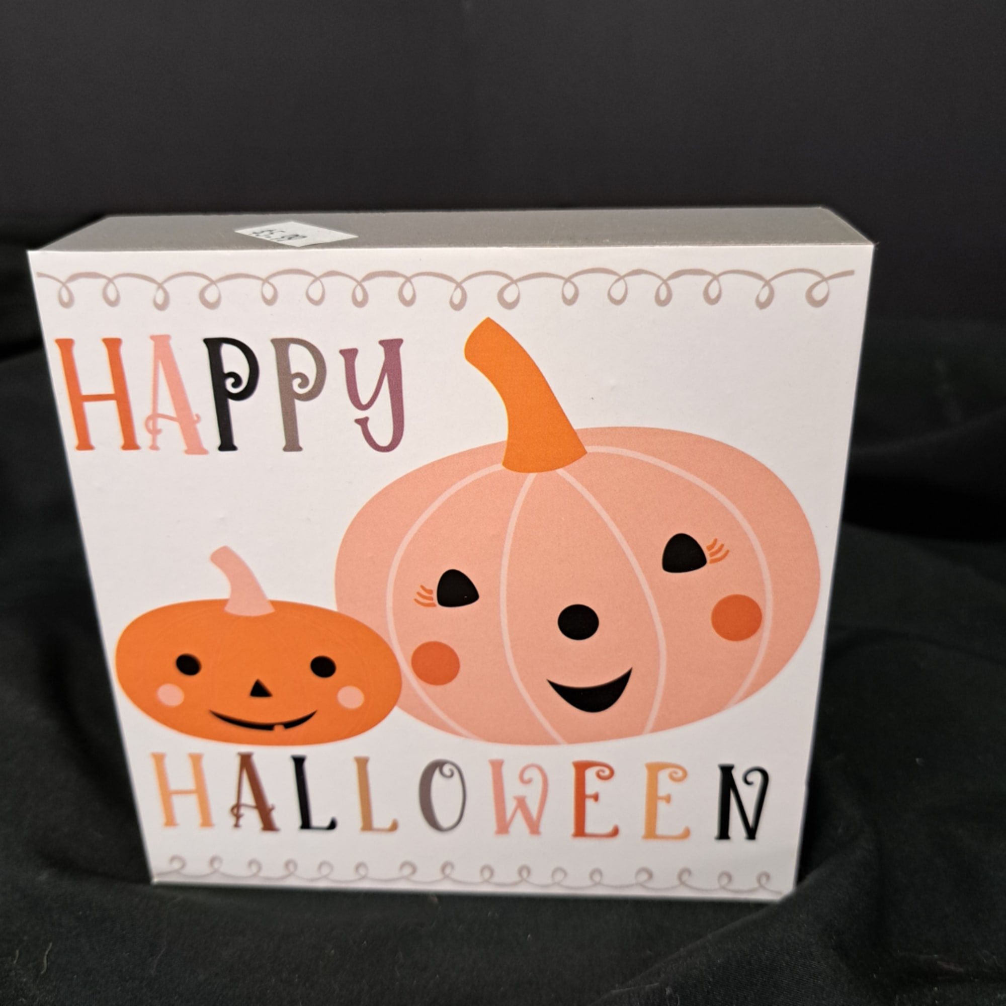 Halloween gift bag with two smiling pumpkins and the words Happy Halloween