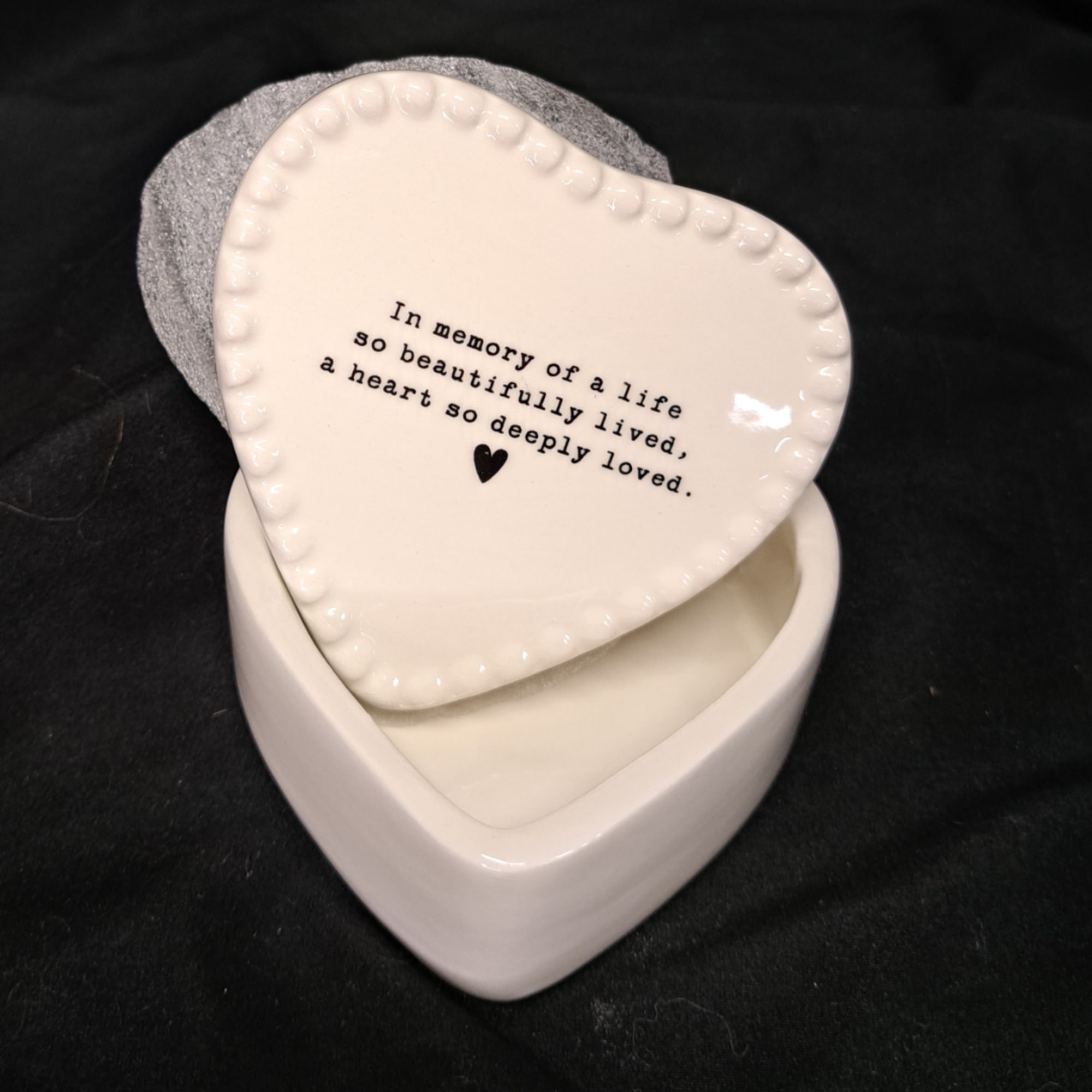 Heart-shaped ceramic keepsake box with a memorial message on the lid