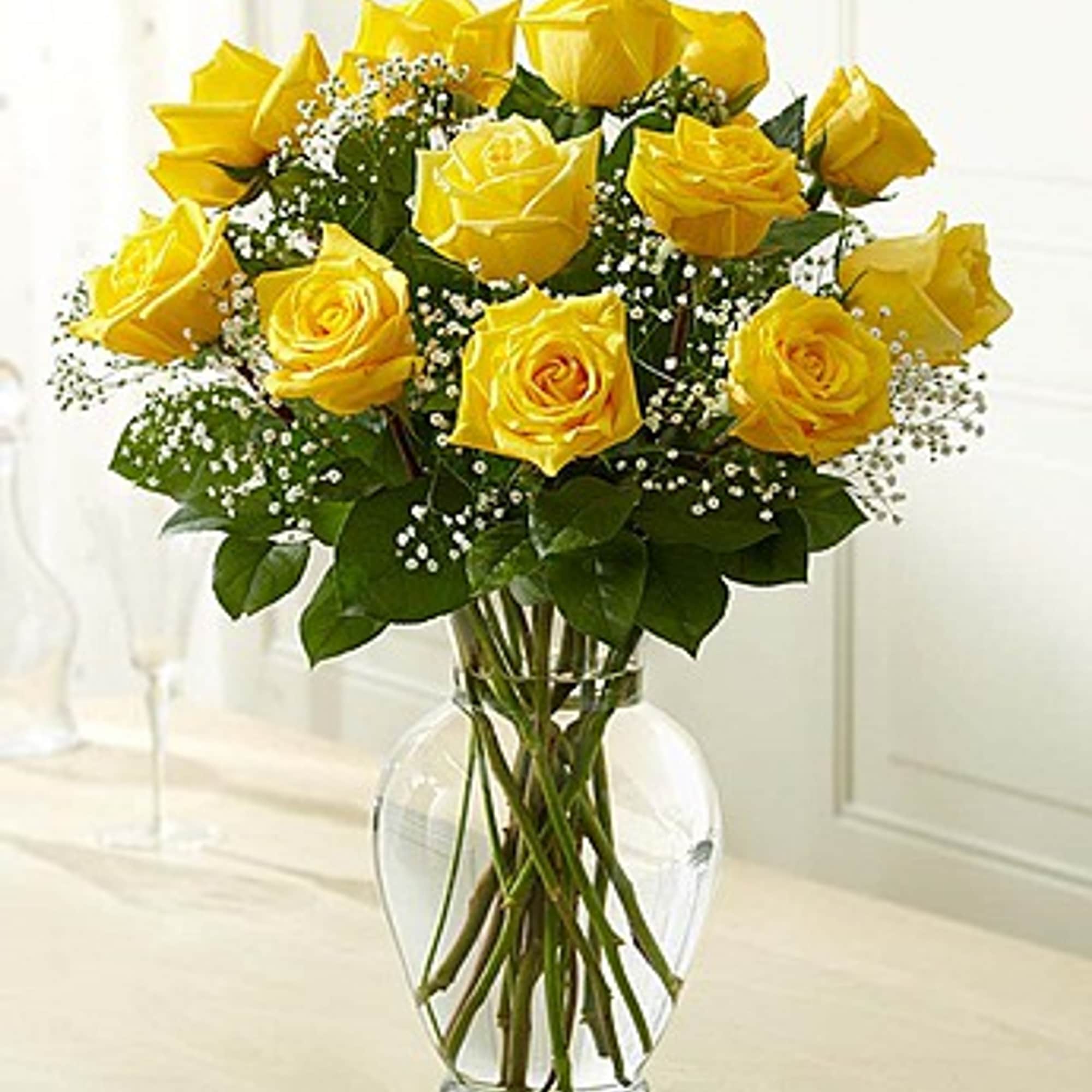 Bouquet of yellow roses in a clear glass vase