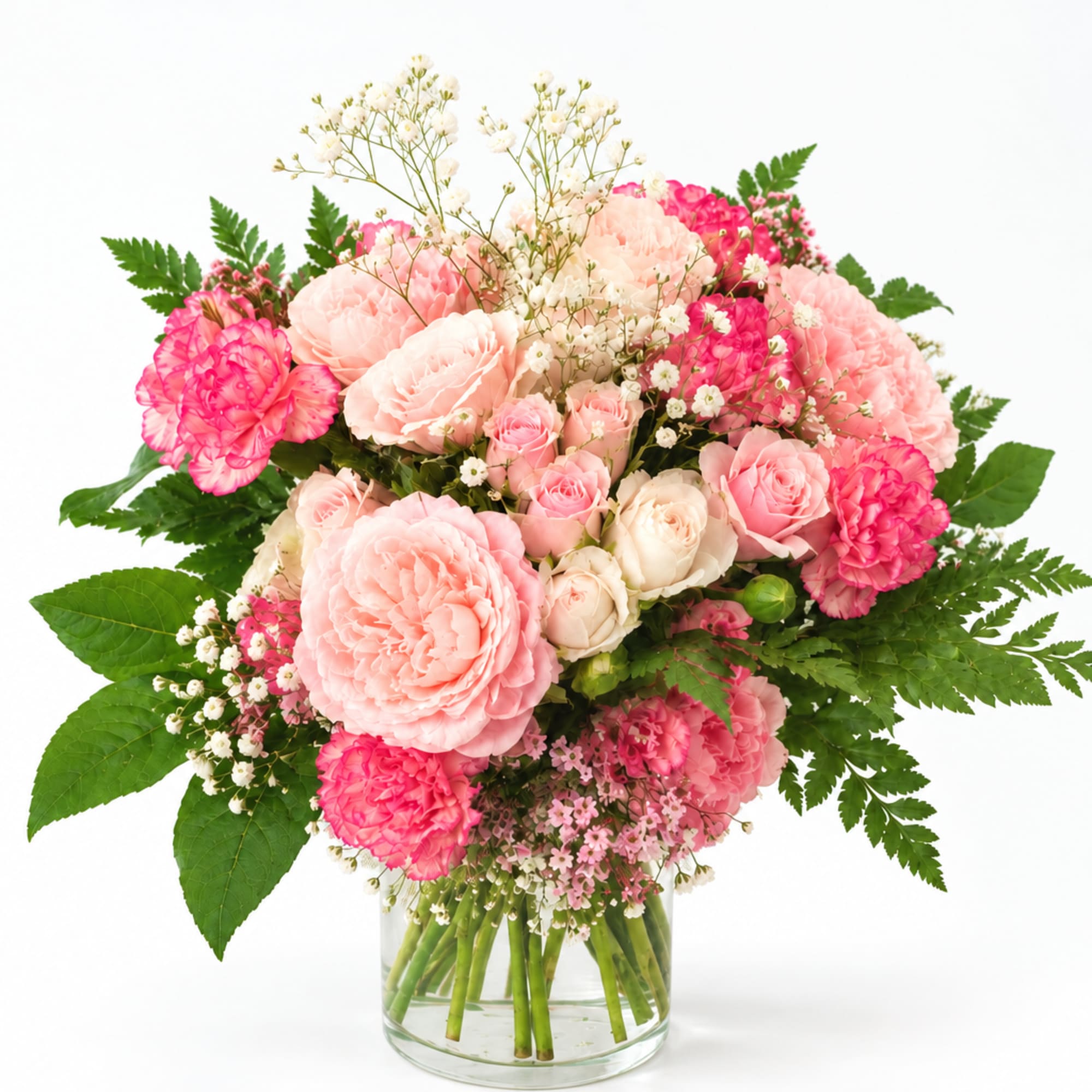 Pink and white mixed bouquet in a clear glass vase