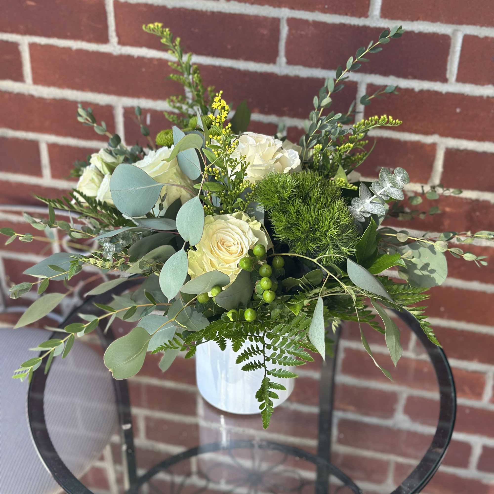 White rose bouquet in a white vase with mixed greenery, photo 2 of 2