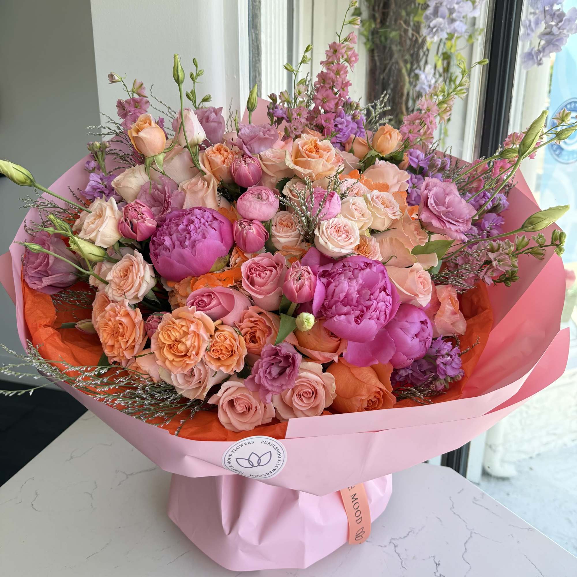 A bold and vibrant bouquet designed to make a lasting impression. Featuring