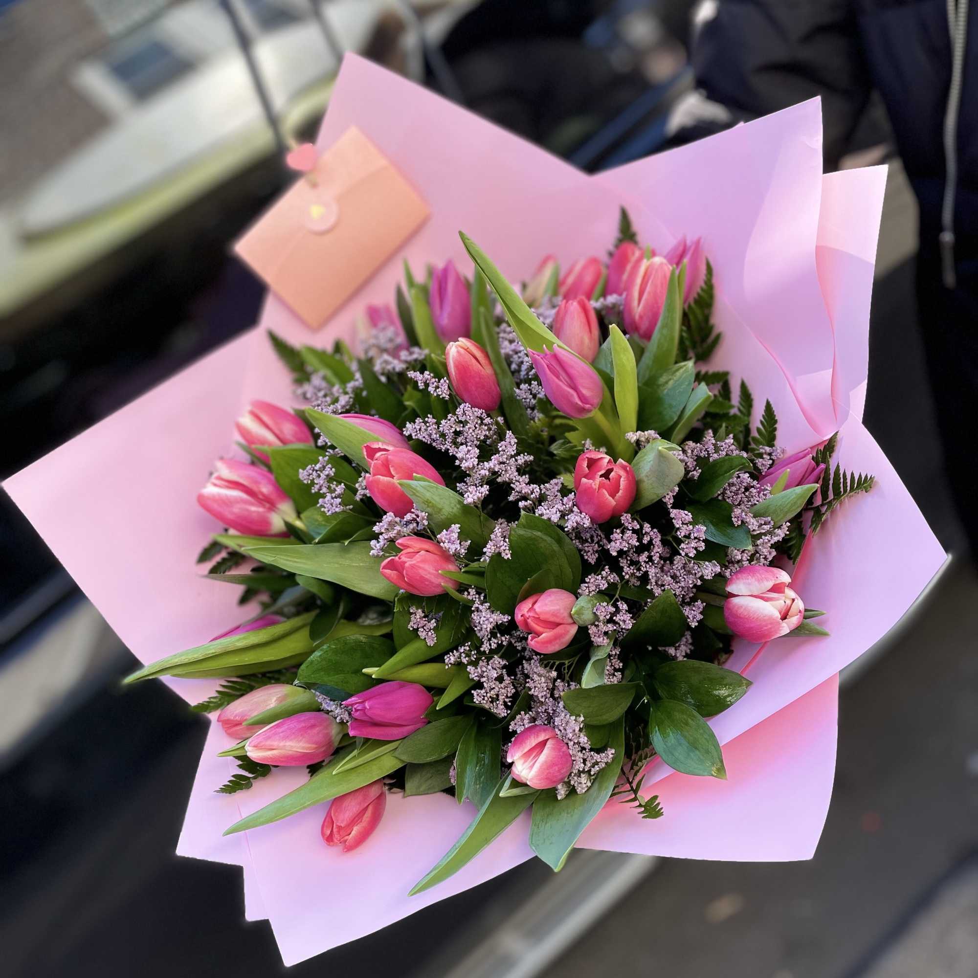 Pink tulip bouquet wrapped in pastel pink paper