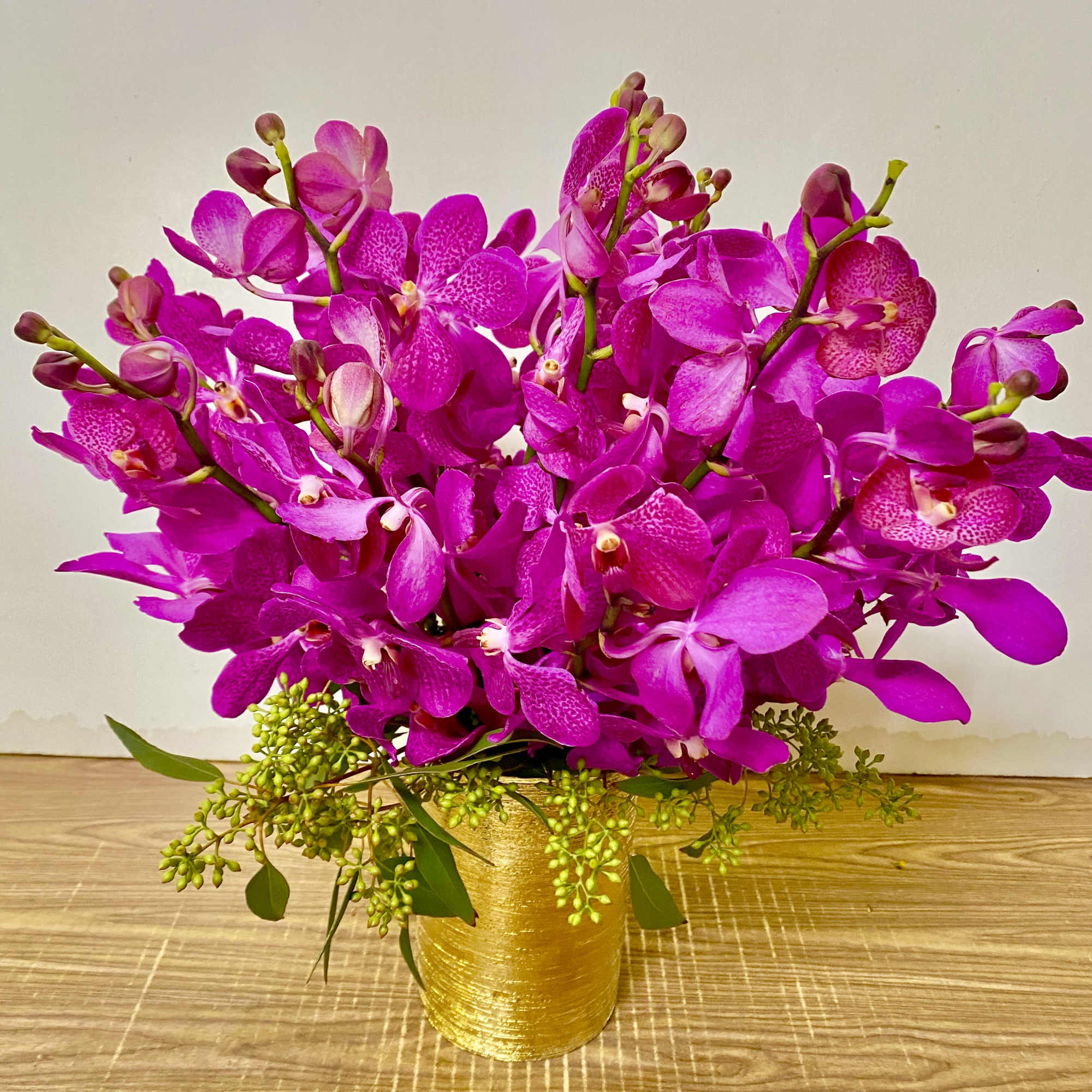 clear glass vase with a black stones and 5 orchids.
Orchids can be, photo 2 of 4
