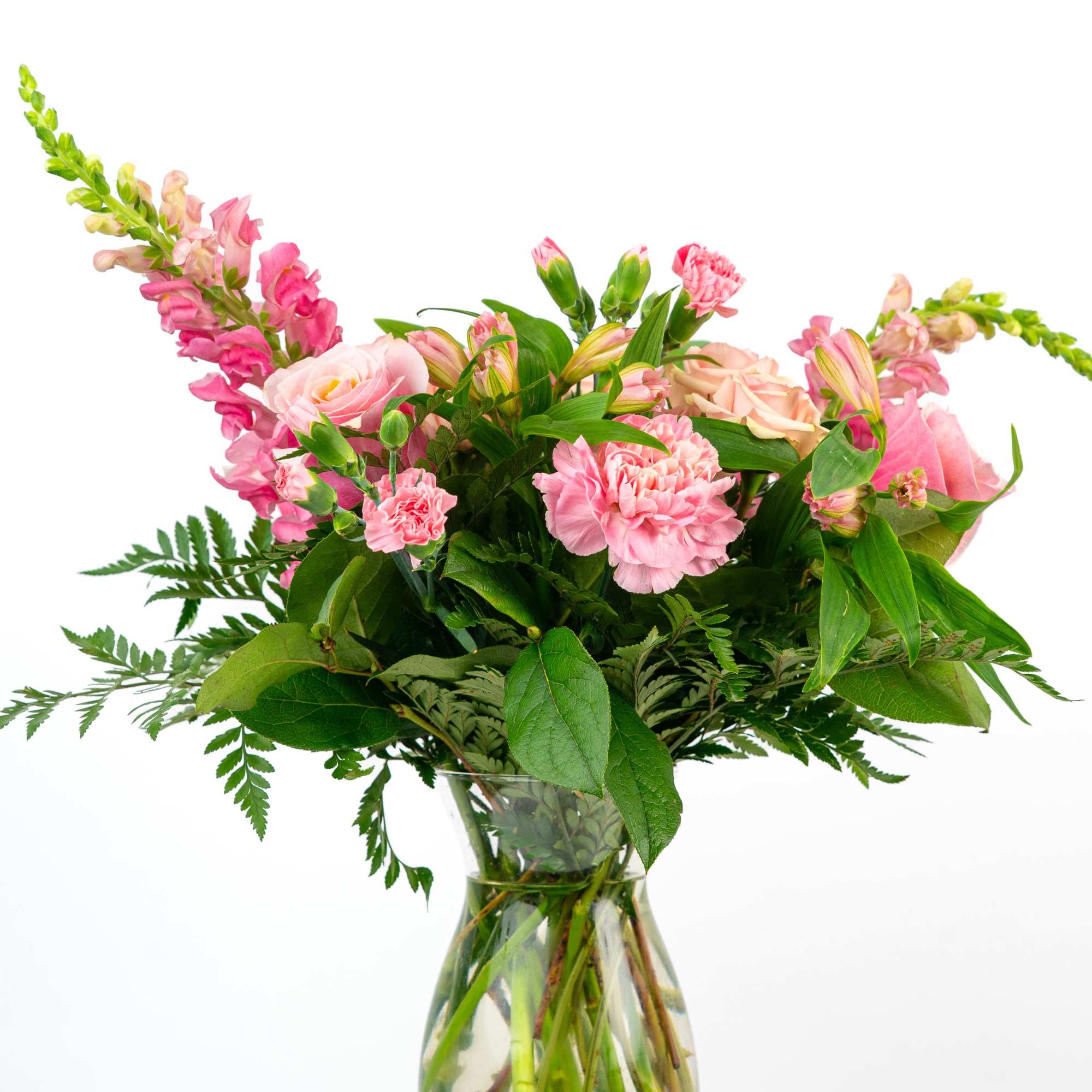 Pink mixed bouquet in a clear glass vase