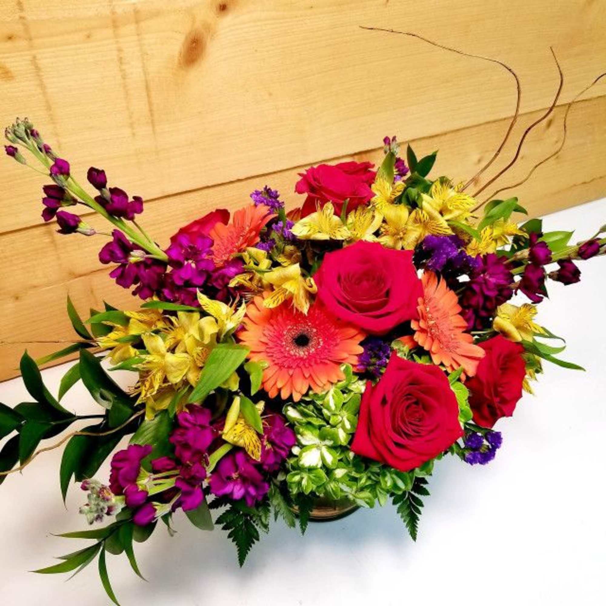 Mixed bouquet with red roses, orange gerberas, and yellow alstroemeria