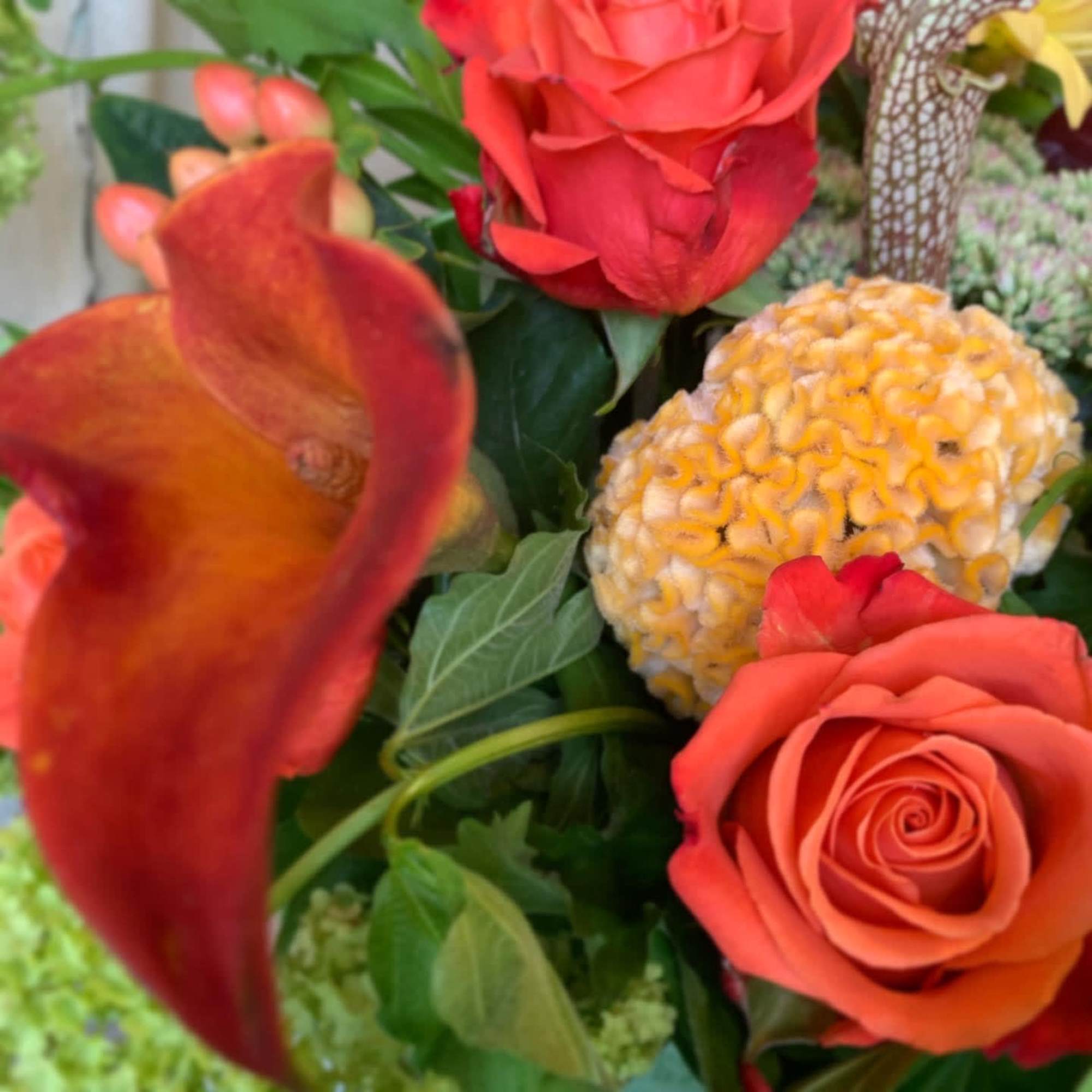A collection of seasonal orange hues - calla lilies, ranunculus and , photo 3 of 4