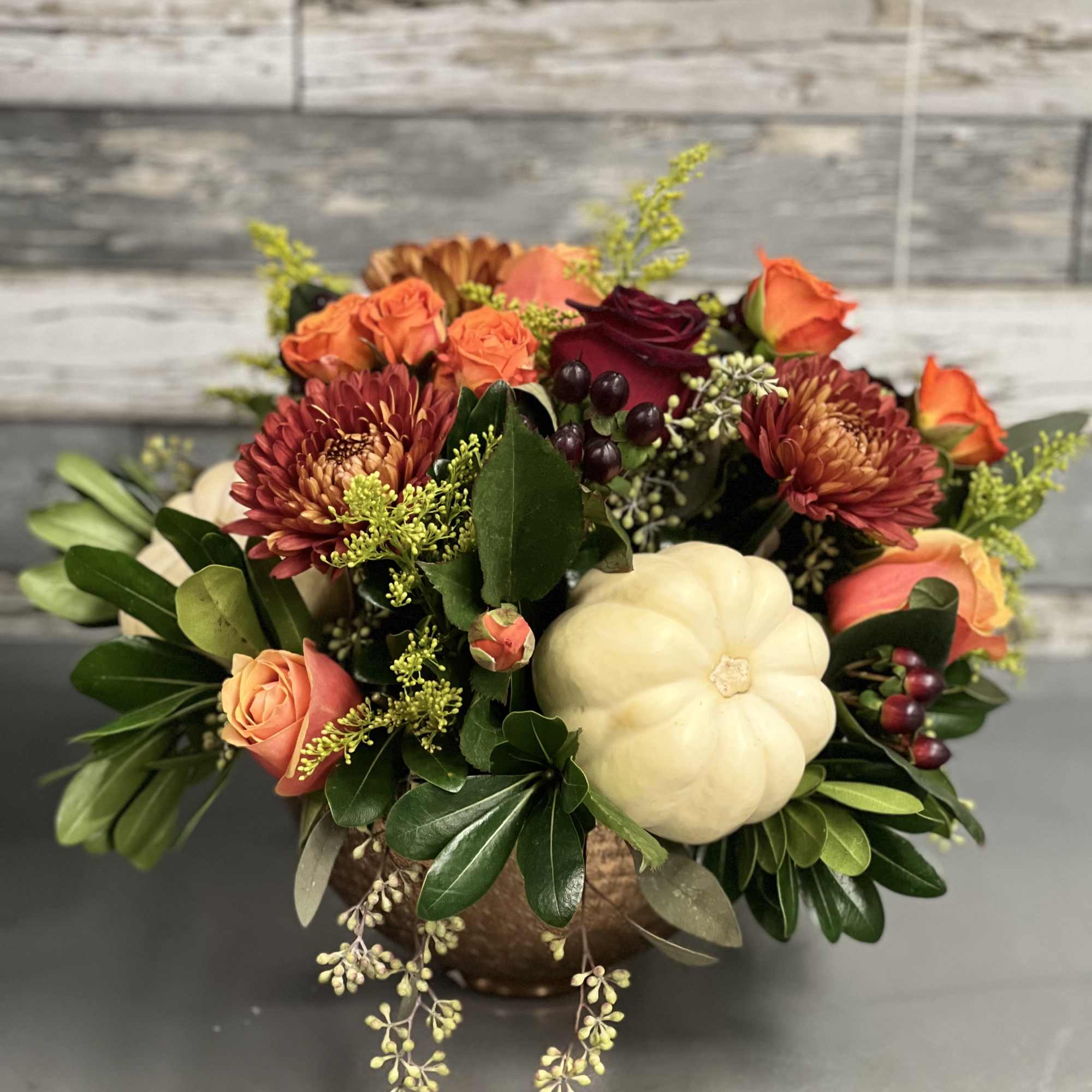 Fall colors and flowers  arranged with small pumpkins in a copper, photo 2 of 2