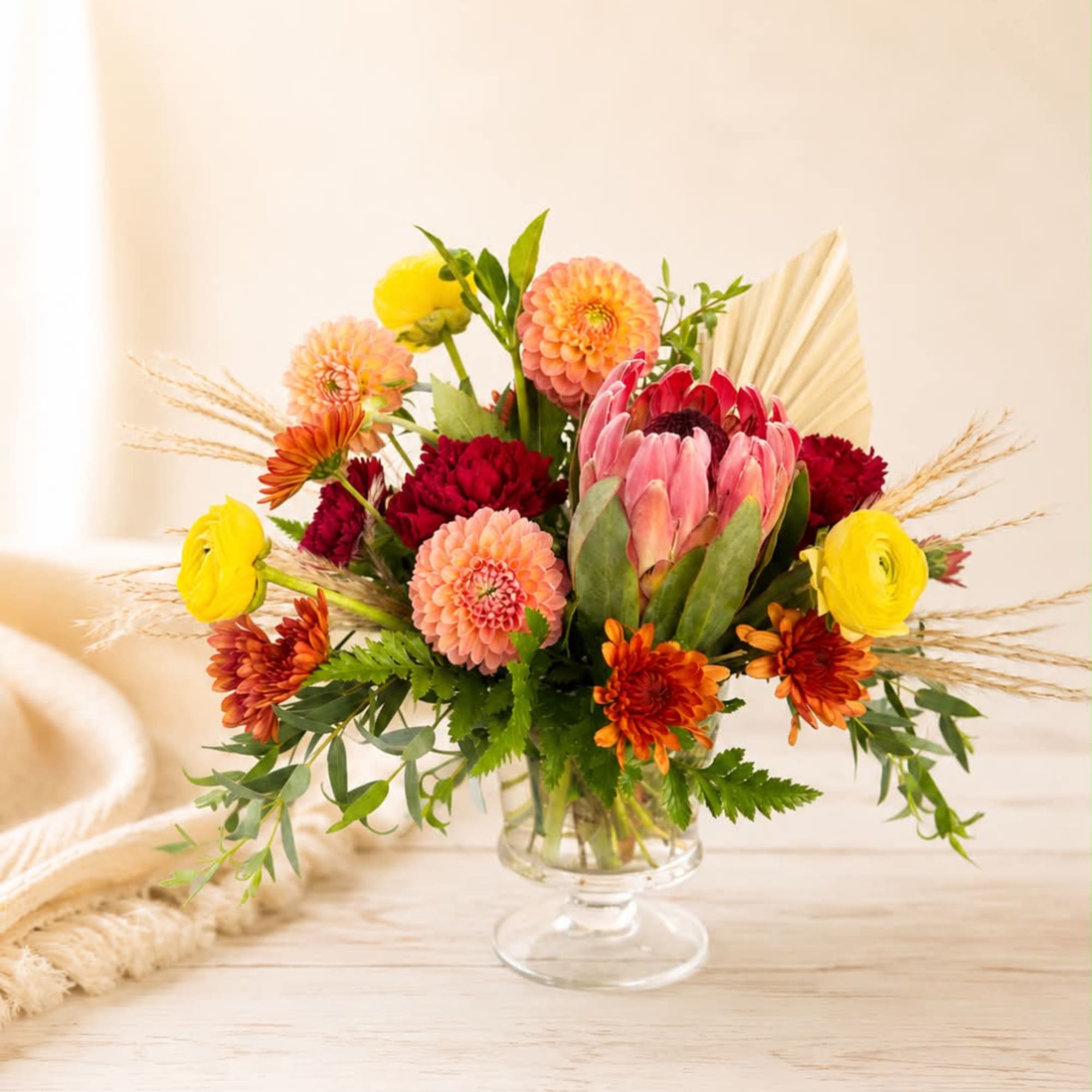 Colorful mixed bouquet in a clear glass vase