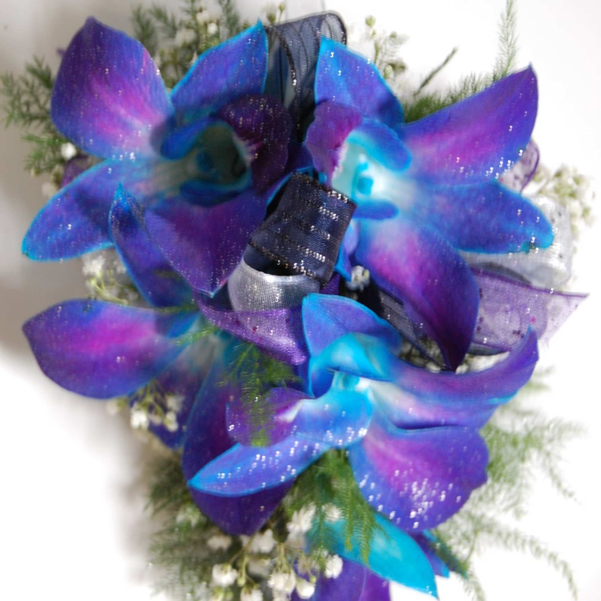 Bouquet of blue-purple orchids with ribbon accents