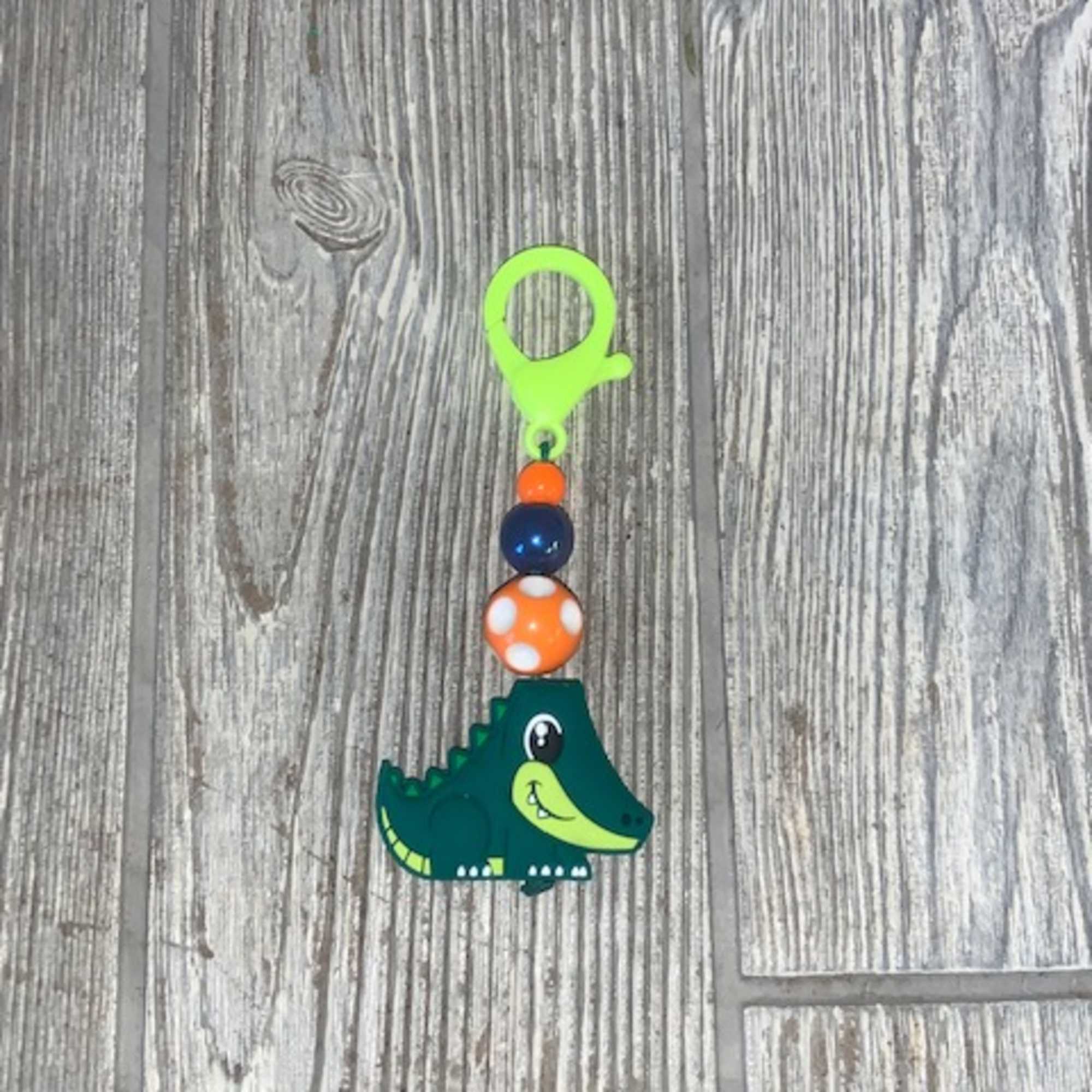 Small crocodile charm with colorful beads on a clip