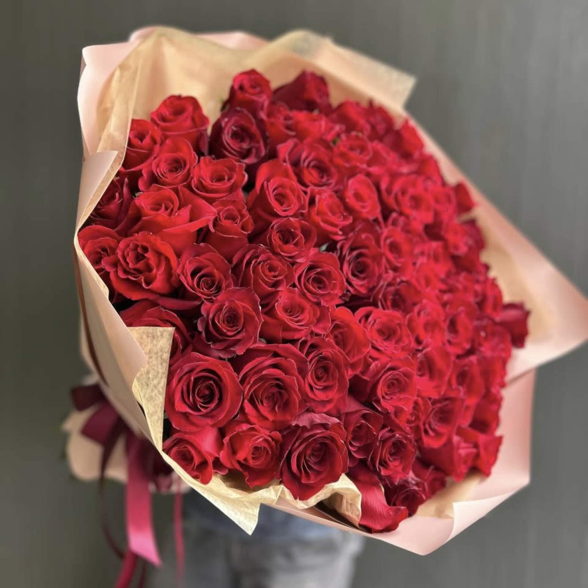 Large bouquet of red roses wrapped in pale pink paper, photo 2 of 4
