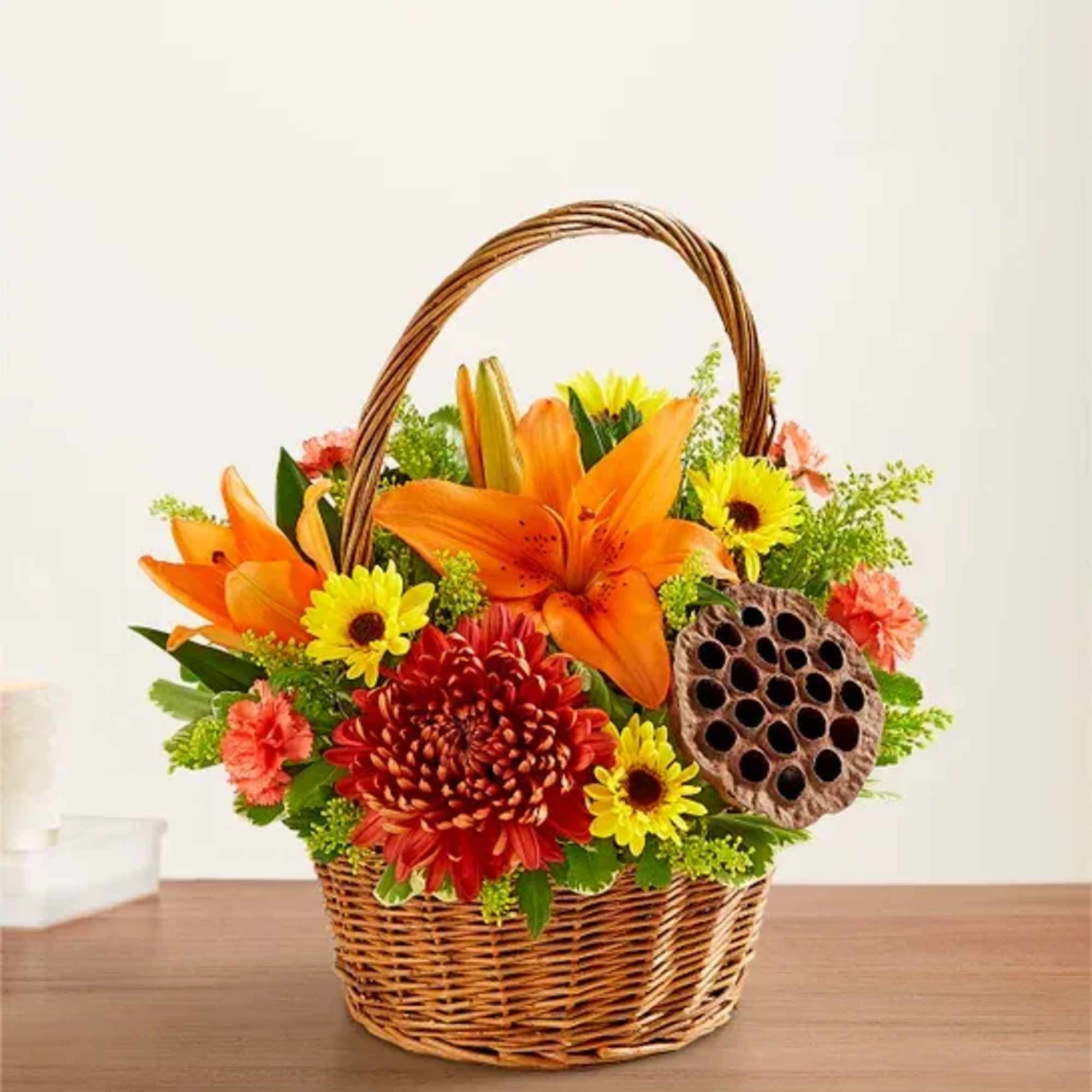 Warm autumn colors arranged artfulling in a wicker basket. ( Basket design