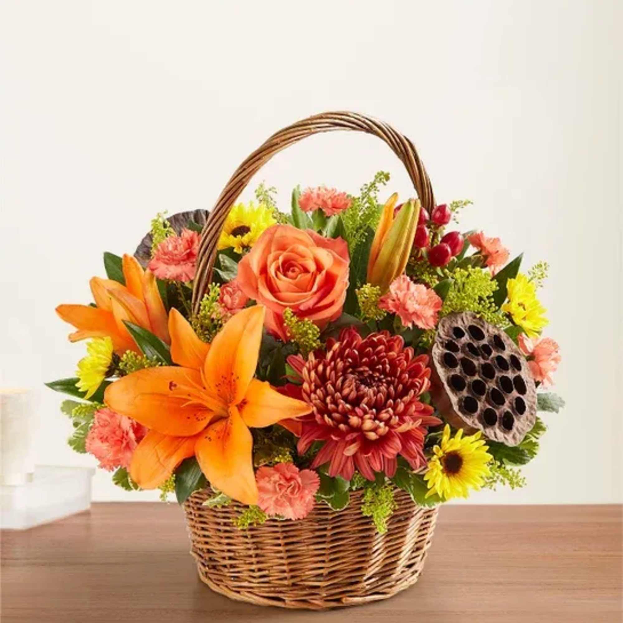 Warm autumn colors arranged artfulling in a wicker basket. ( Basket design