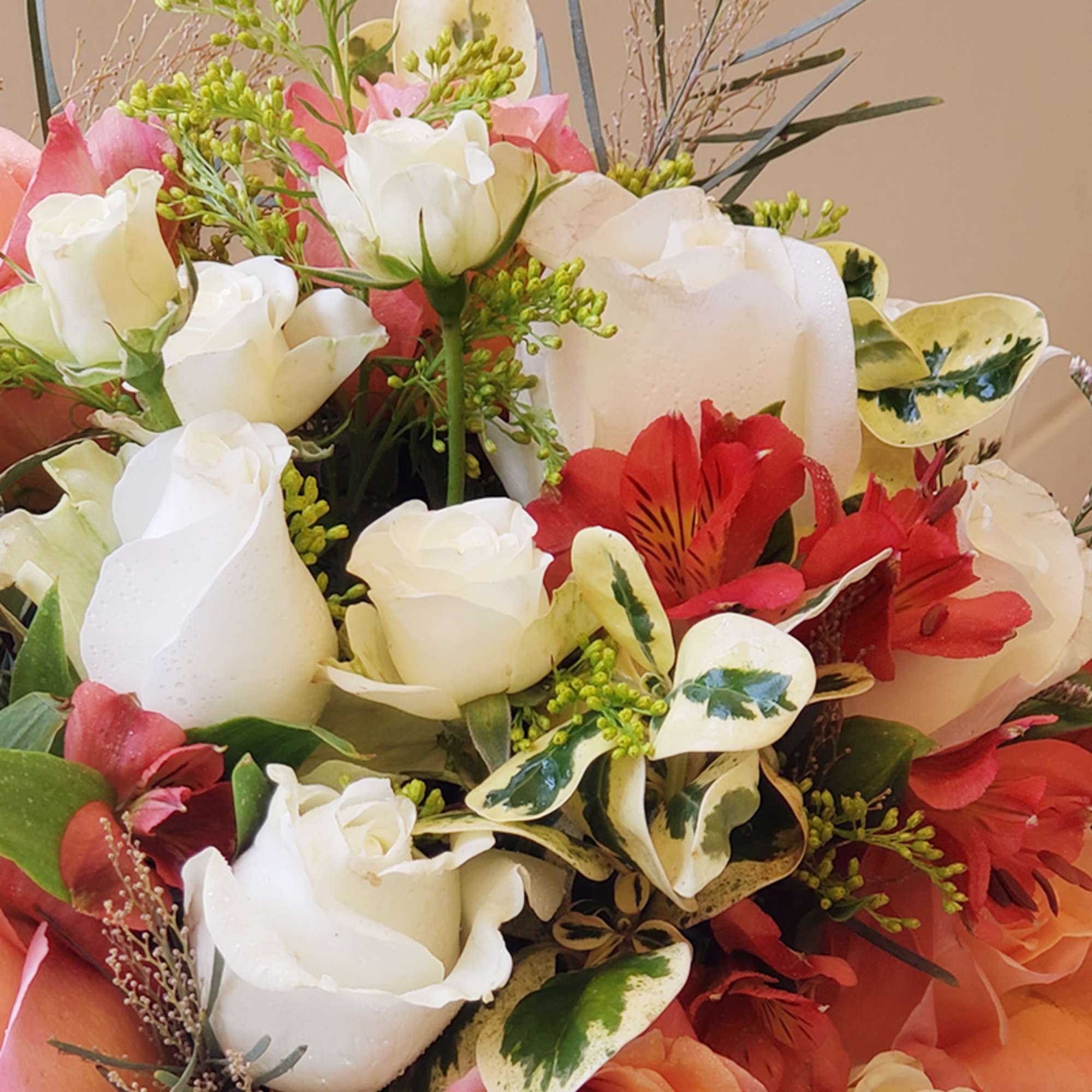 Bouquet of white and red roses with pink accents