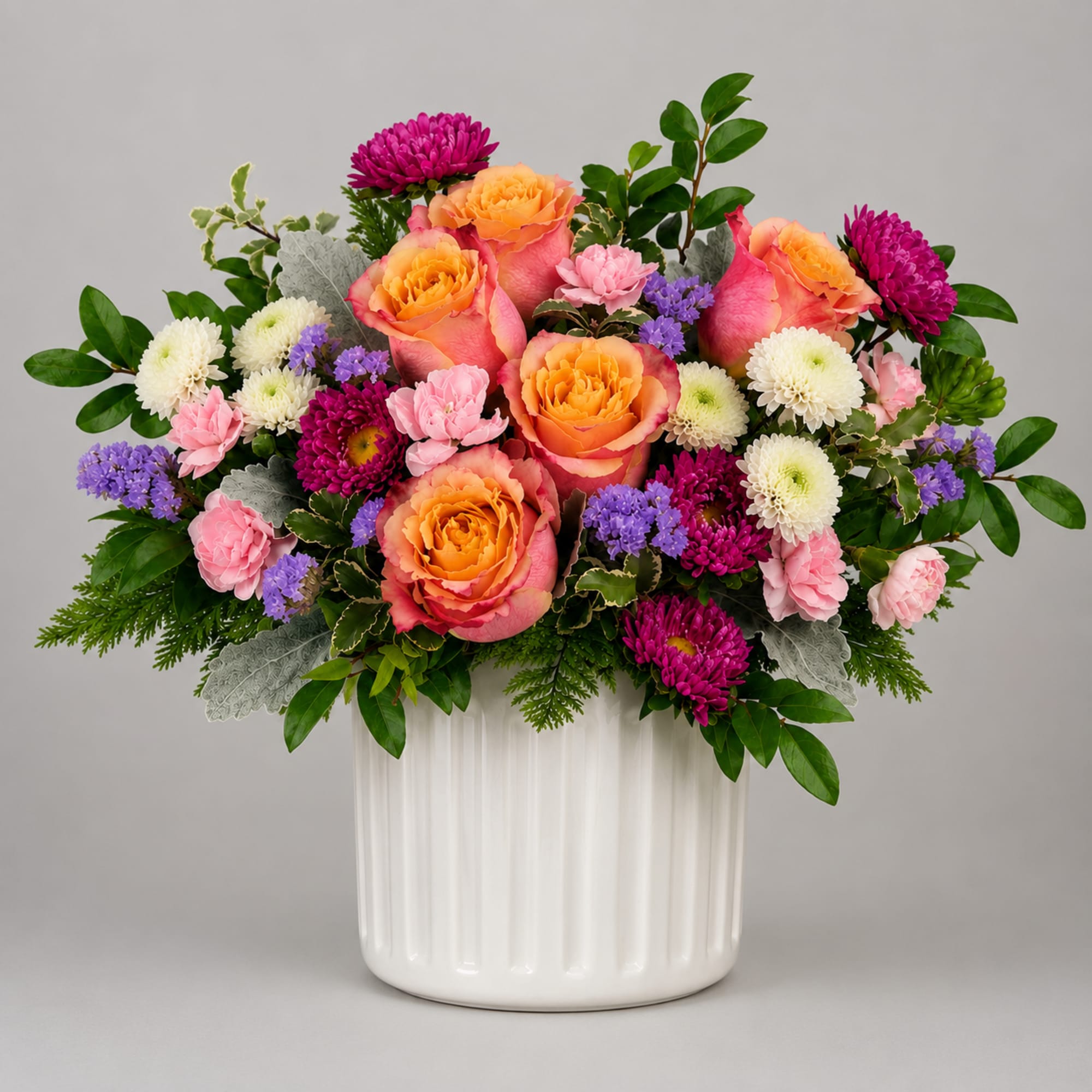 Brighten someone's day with this charming floral arrangement, designed to bring warmth