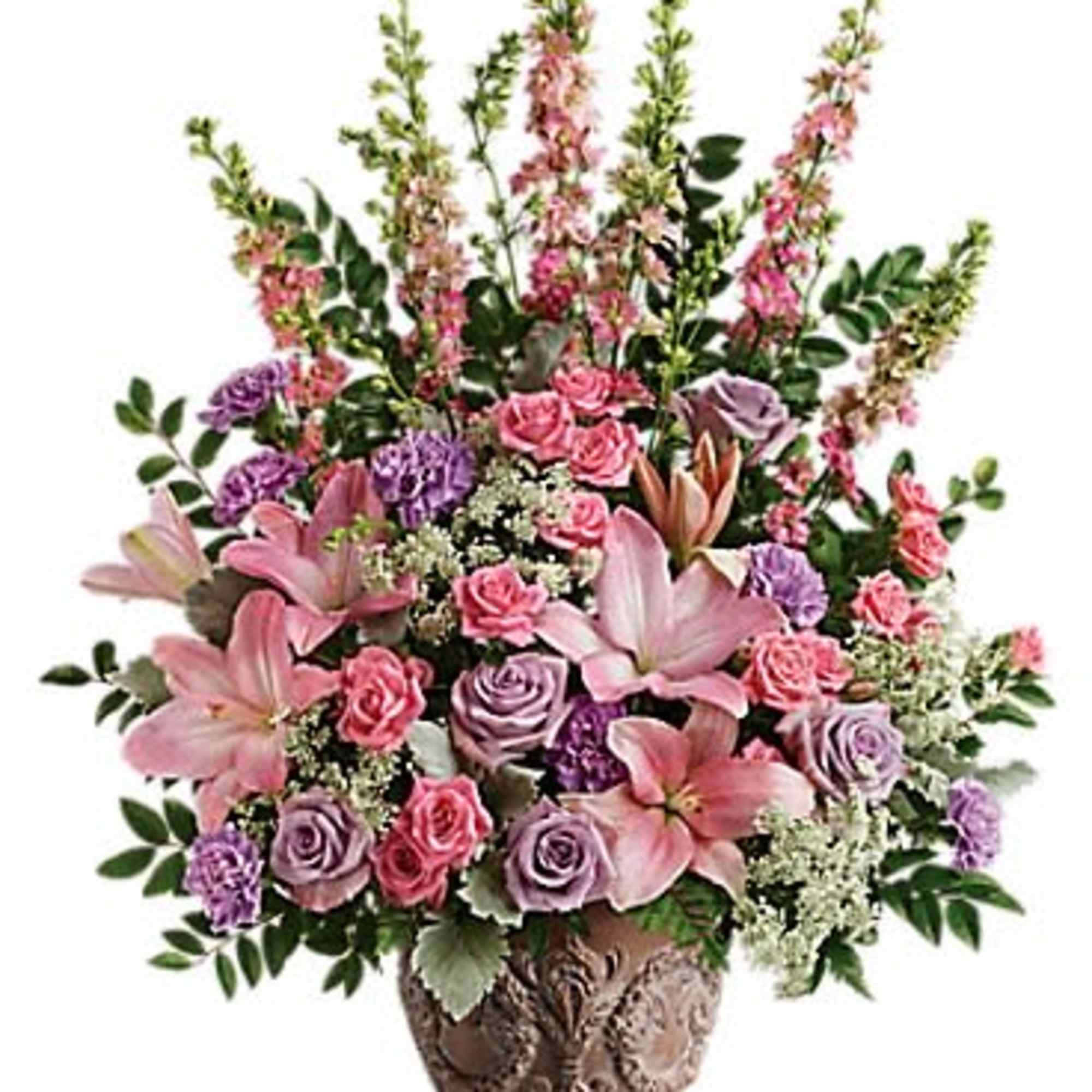 Tall pink and lavender flower arrangement with lilies and roses in an ornate brown vase