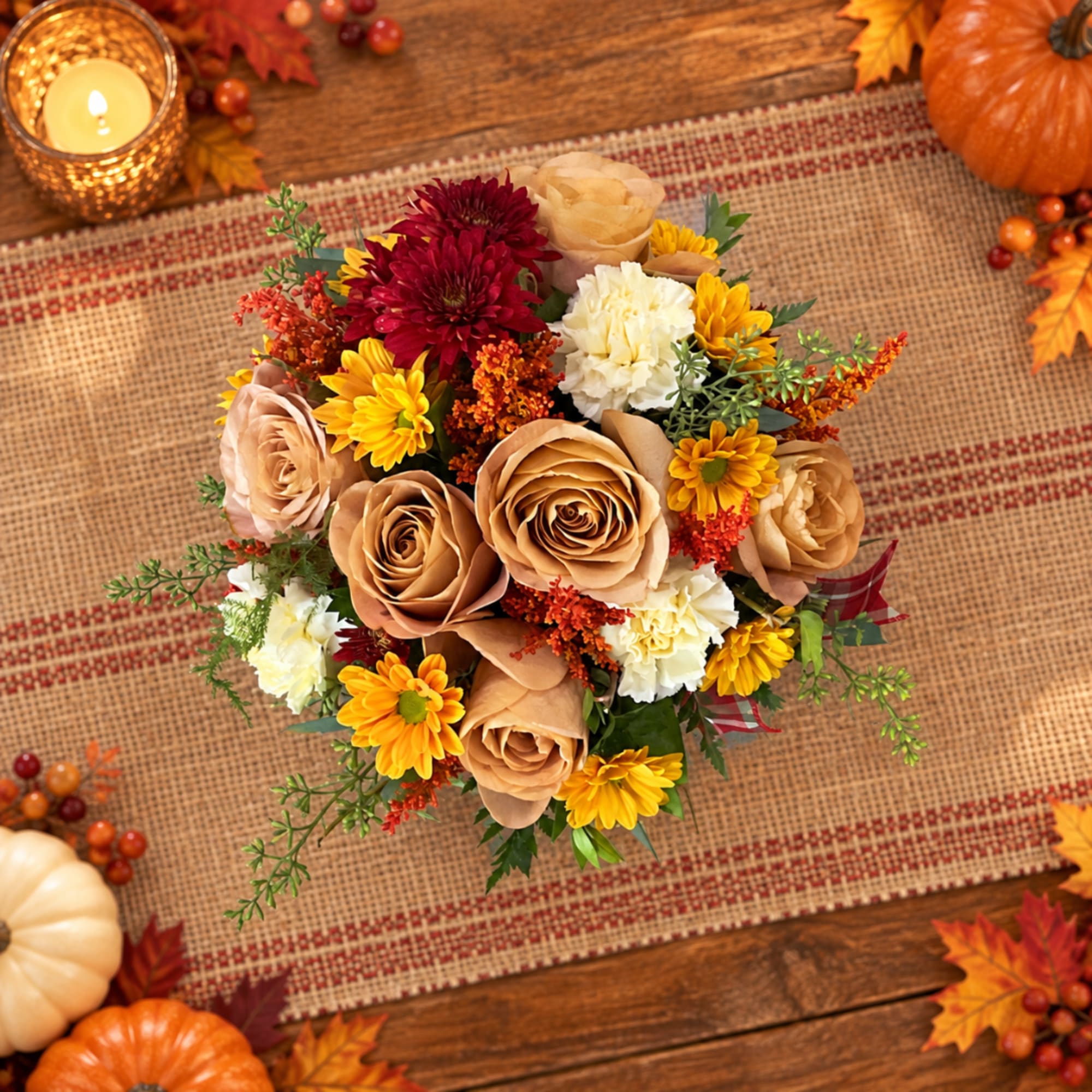 Autumn bouquet with tan roses, yellow daisies, and burgundy mums