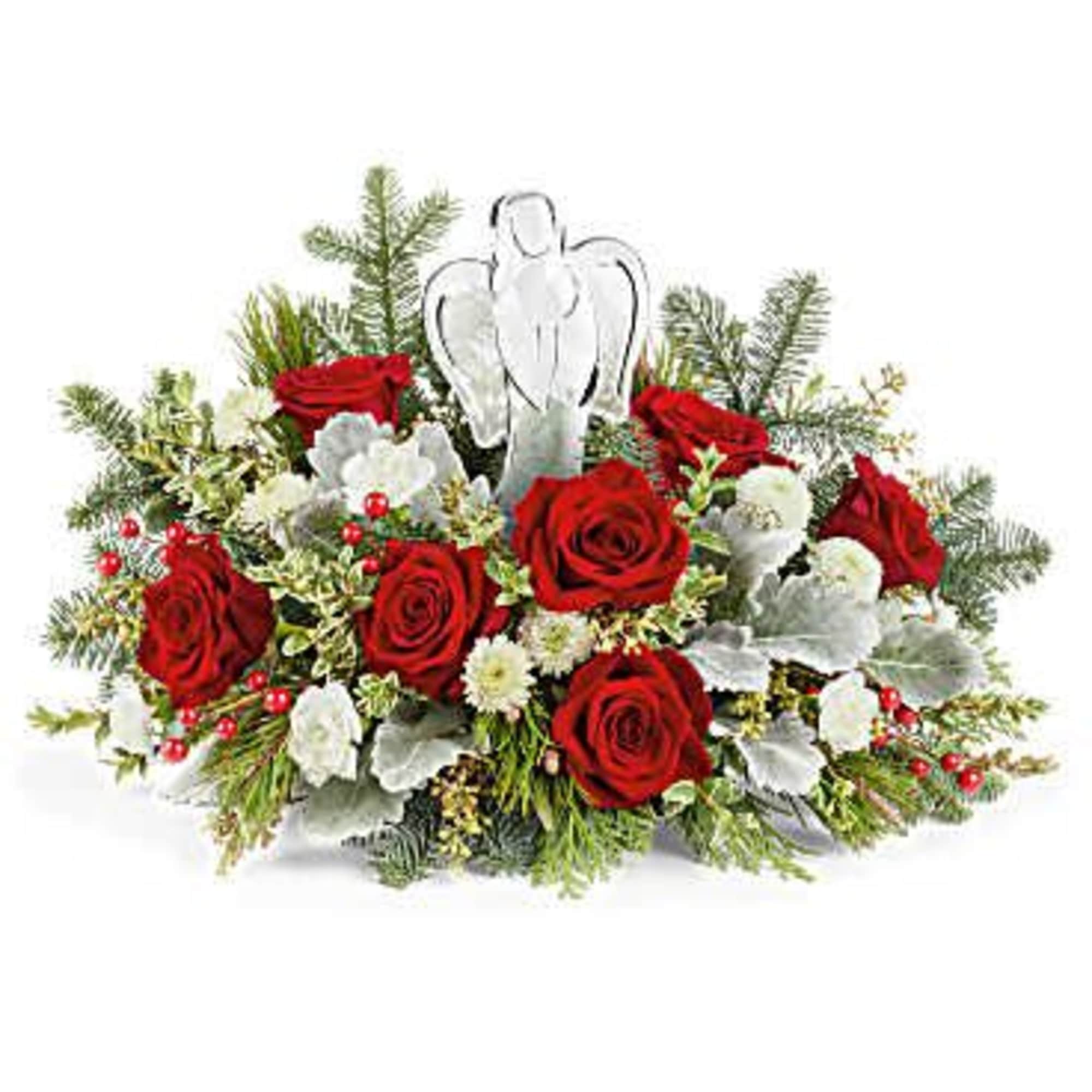 Red roses and white flowers arranged with an angel ornament