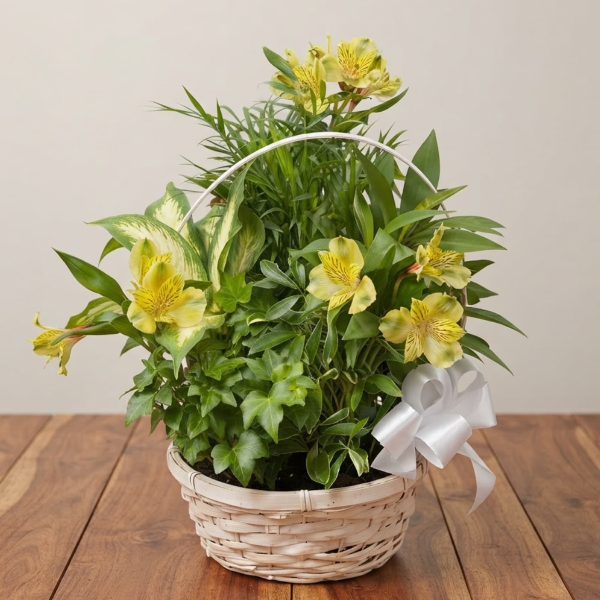Yellow flowers in a wicker basket with a white ribbon bow