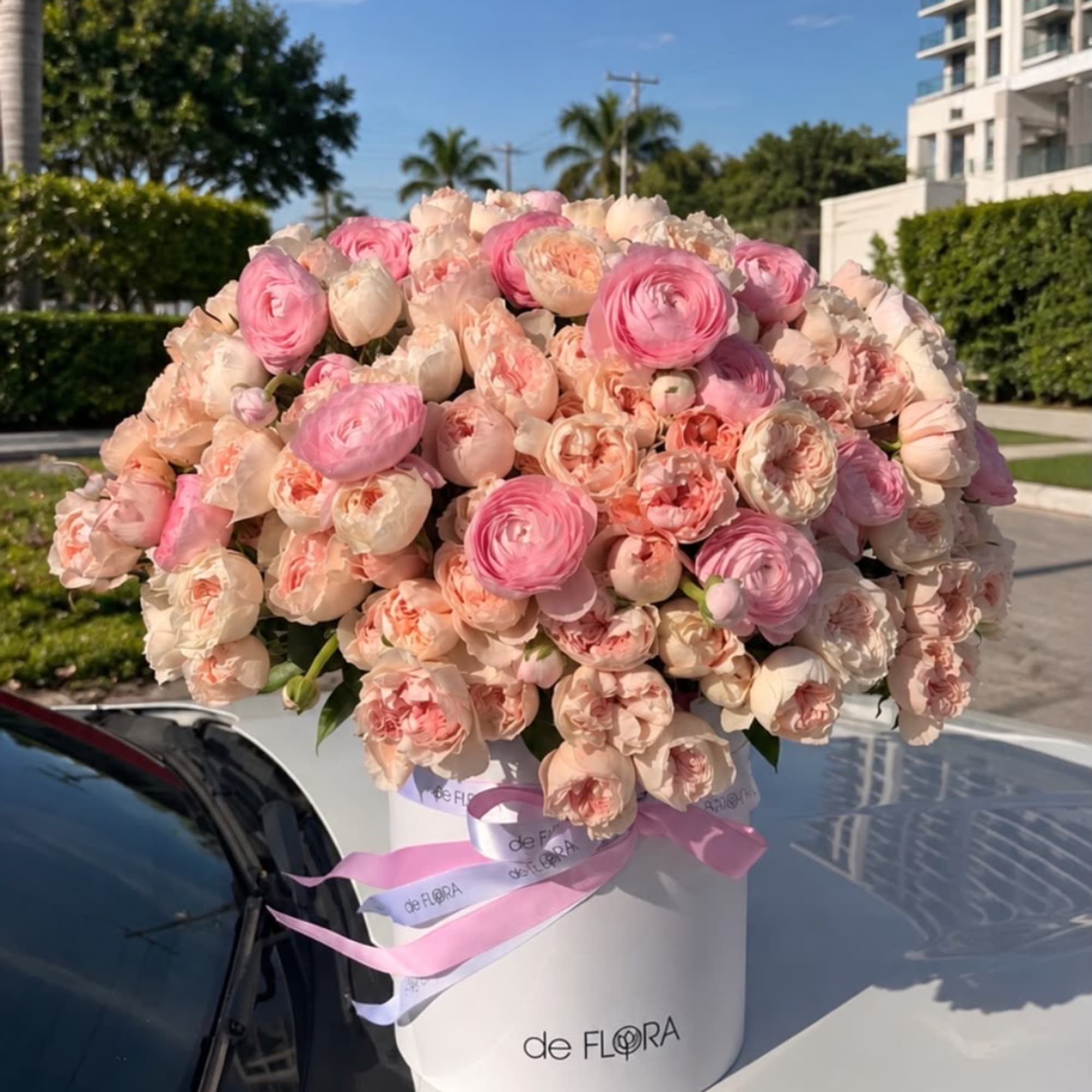 Large pink and blush bouquet in a white hatbox with ribbon