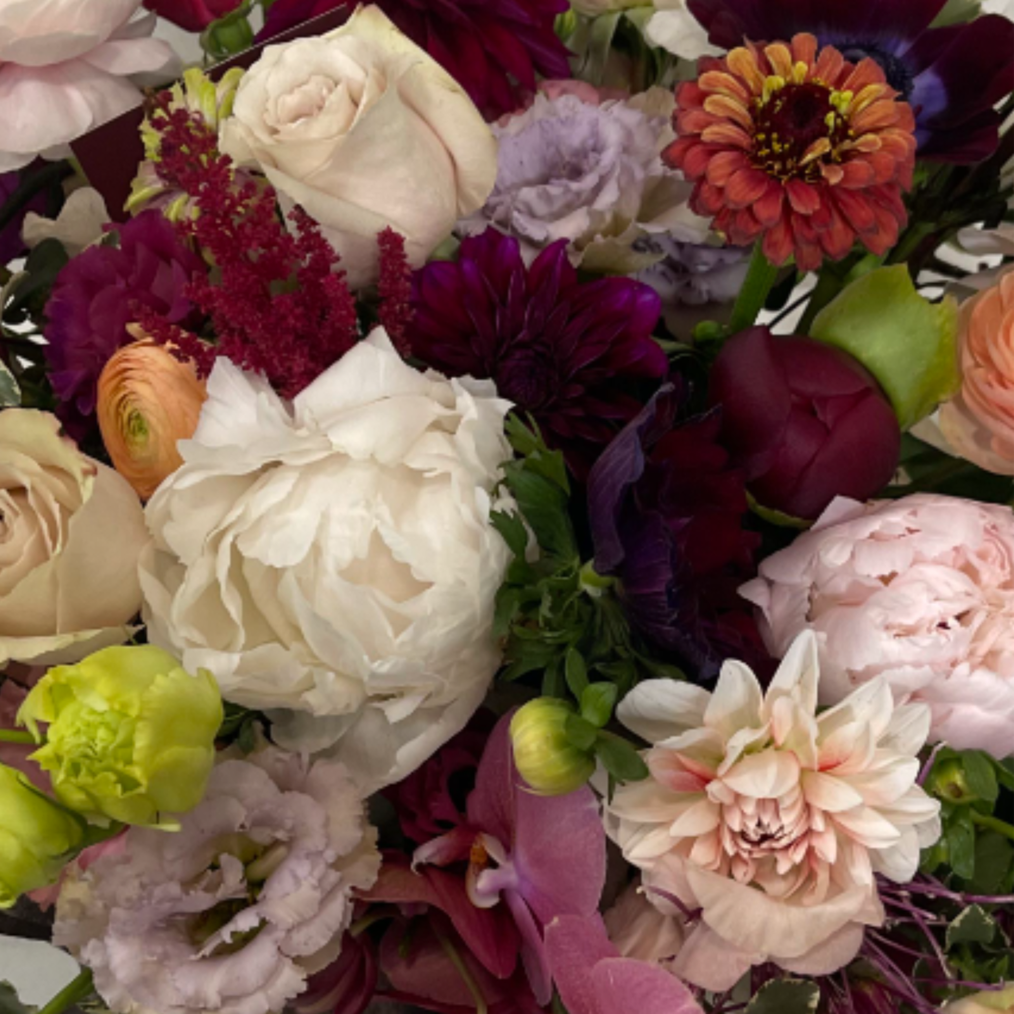 Floral arrangement in seasonal autumn hues - peach, orange, yellow, fuchsia, magenta, photo 2 of 2