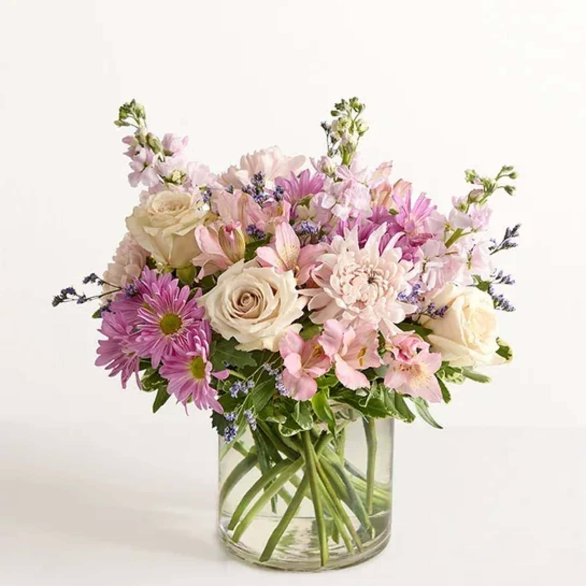 Pink and white mixed bouquet in a clear glass vase
