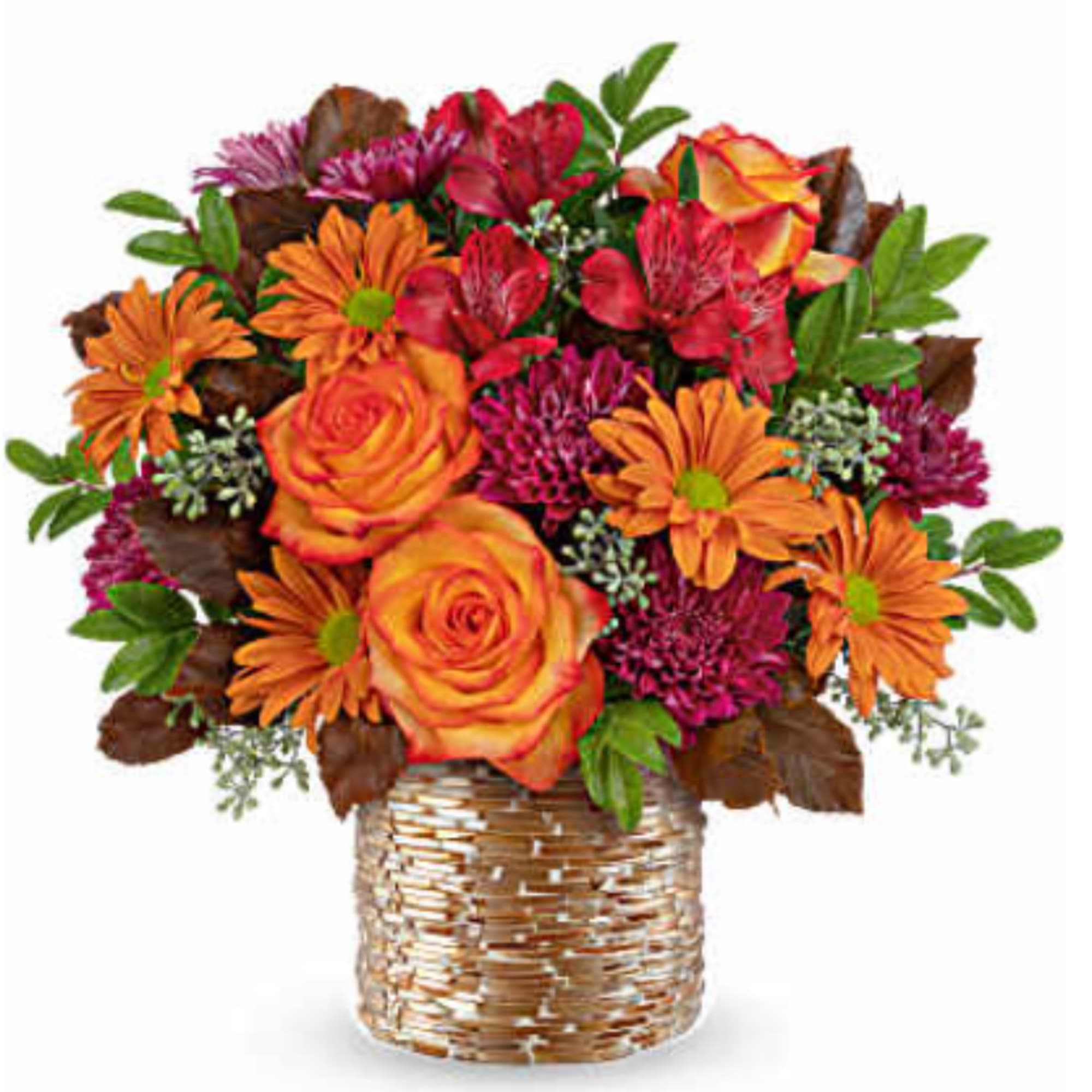 Orange and red mixed bouquet in a woven basket vase