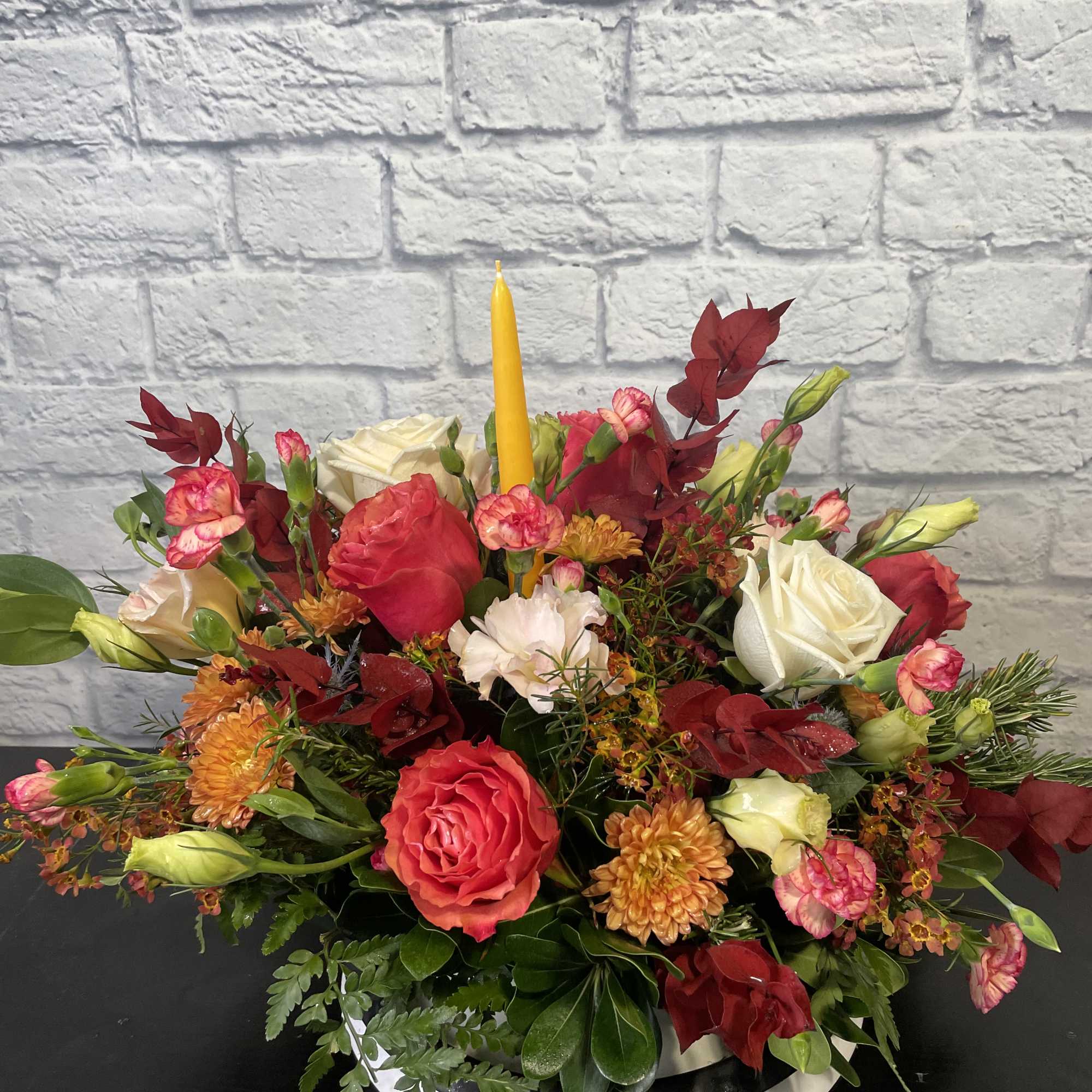 We'll design a beautiful fall Thanksgiving Centerpiece for the table.  We
