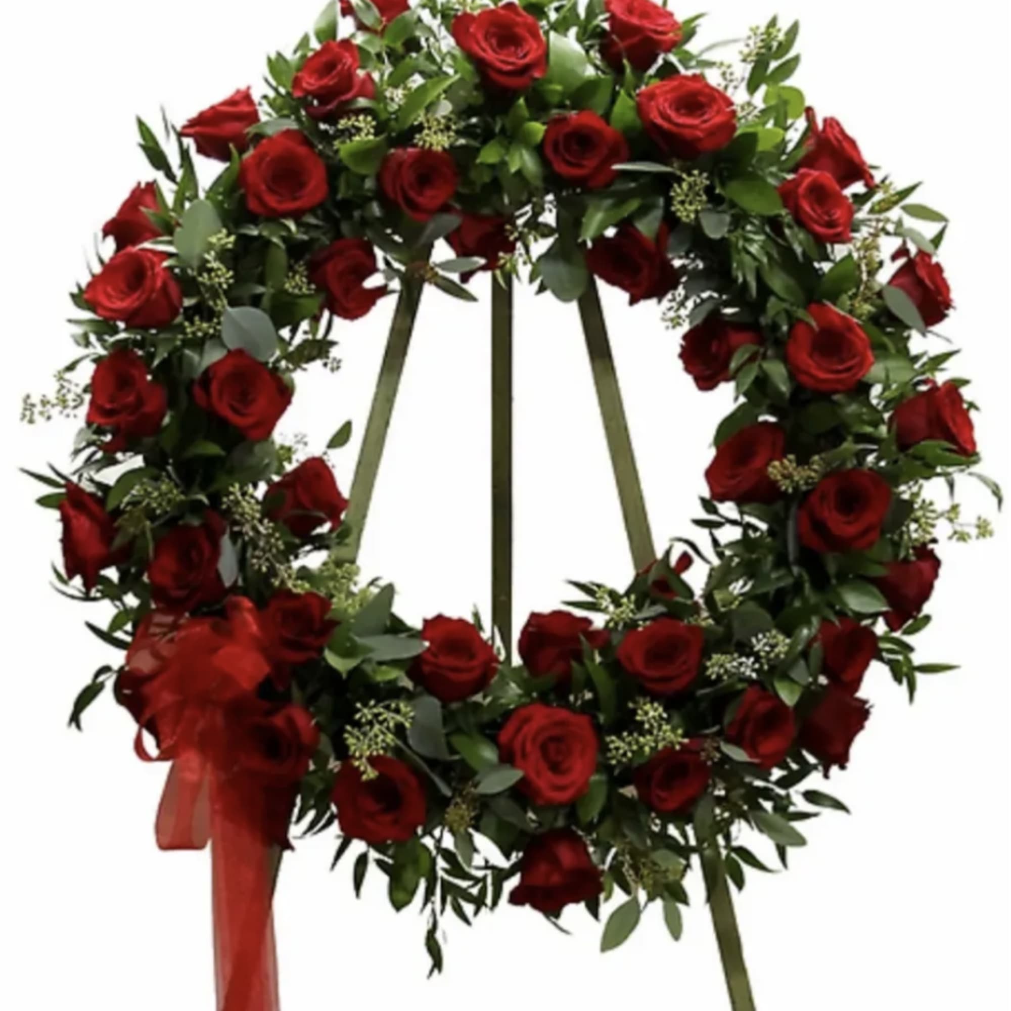 Red rose wreath with a red ribbon on a standing easel
