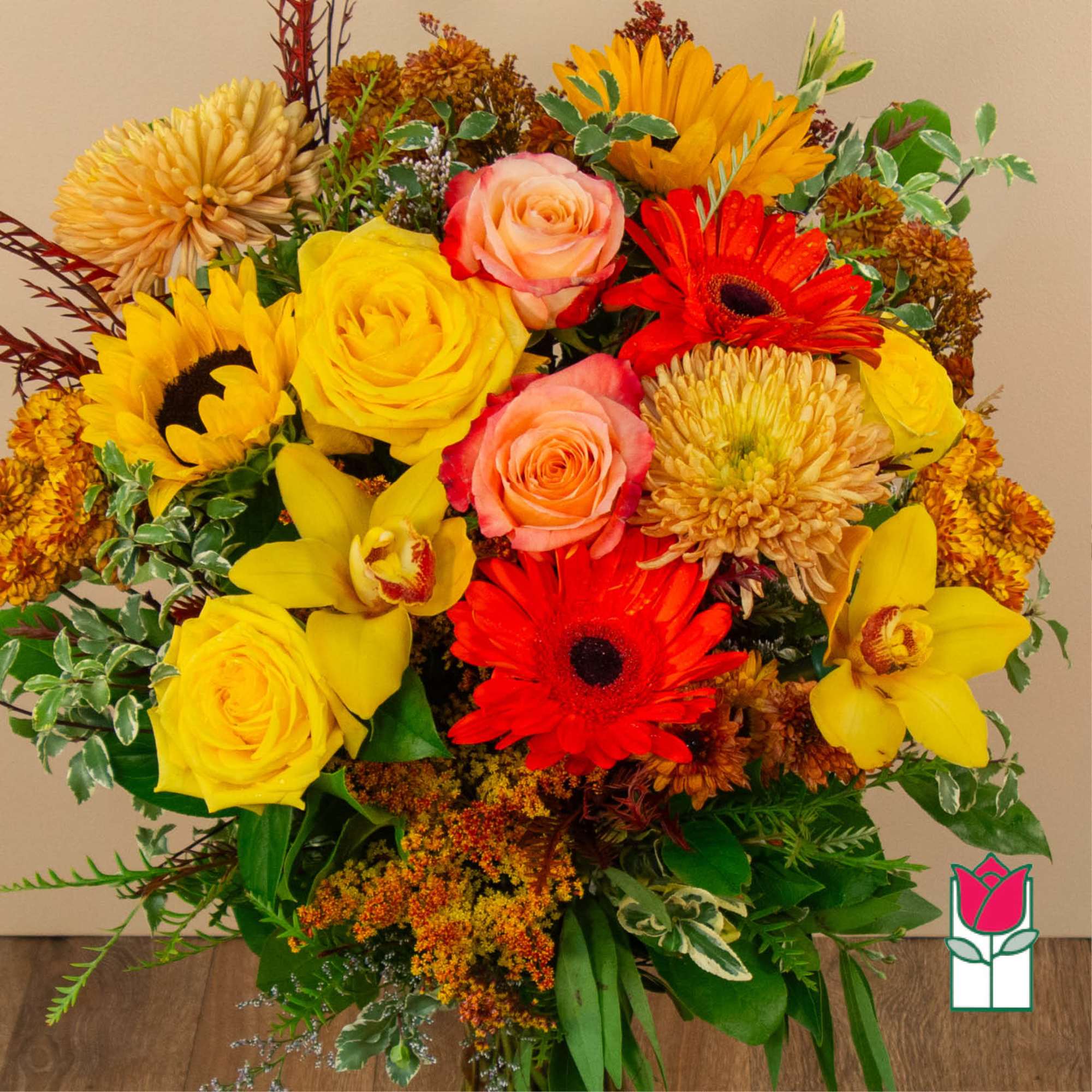 Mixed bouquet with yellow roses, sunflowers, gerberas, and orchids