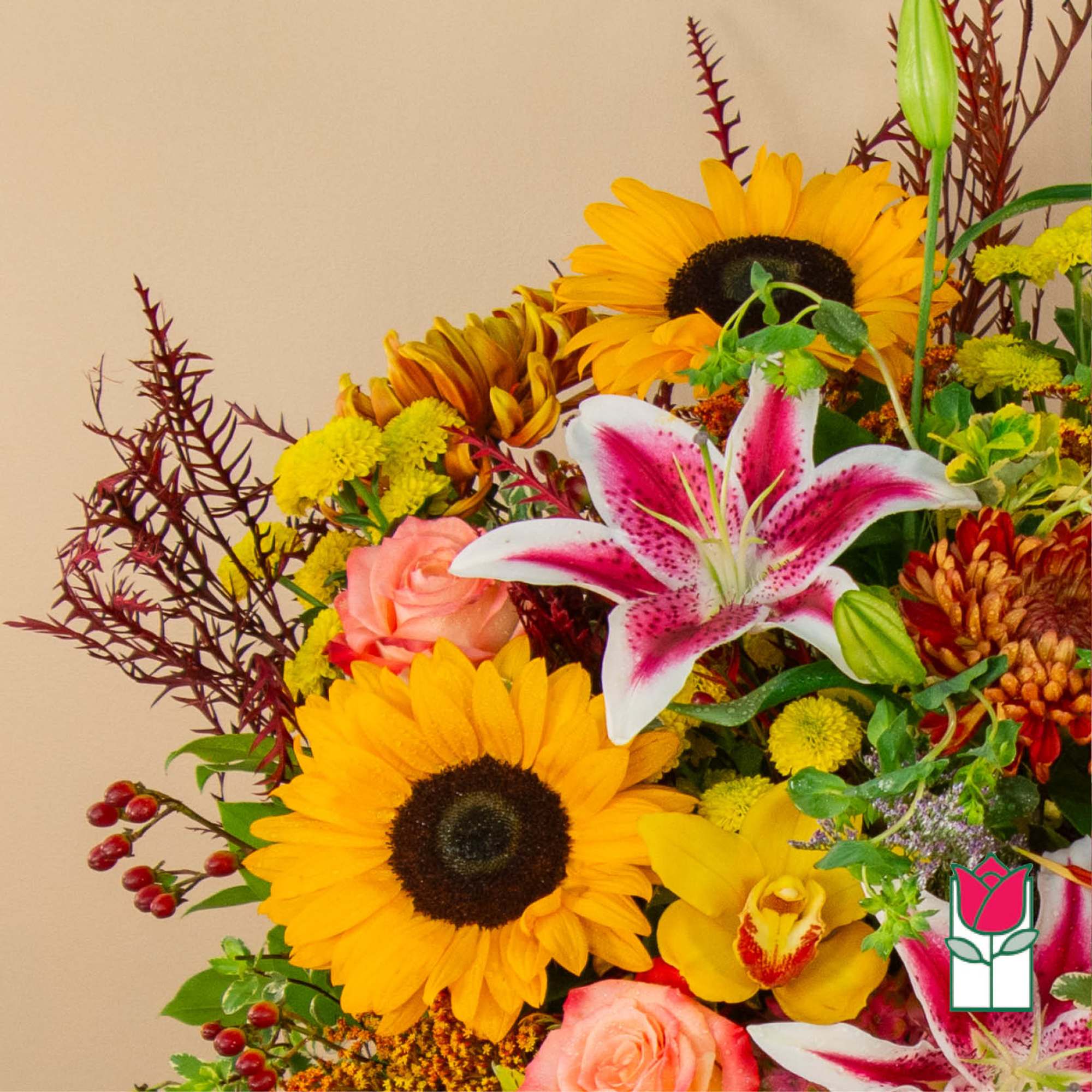 Mixed bouquet with sunflowers, lilies, roses, and orchids