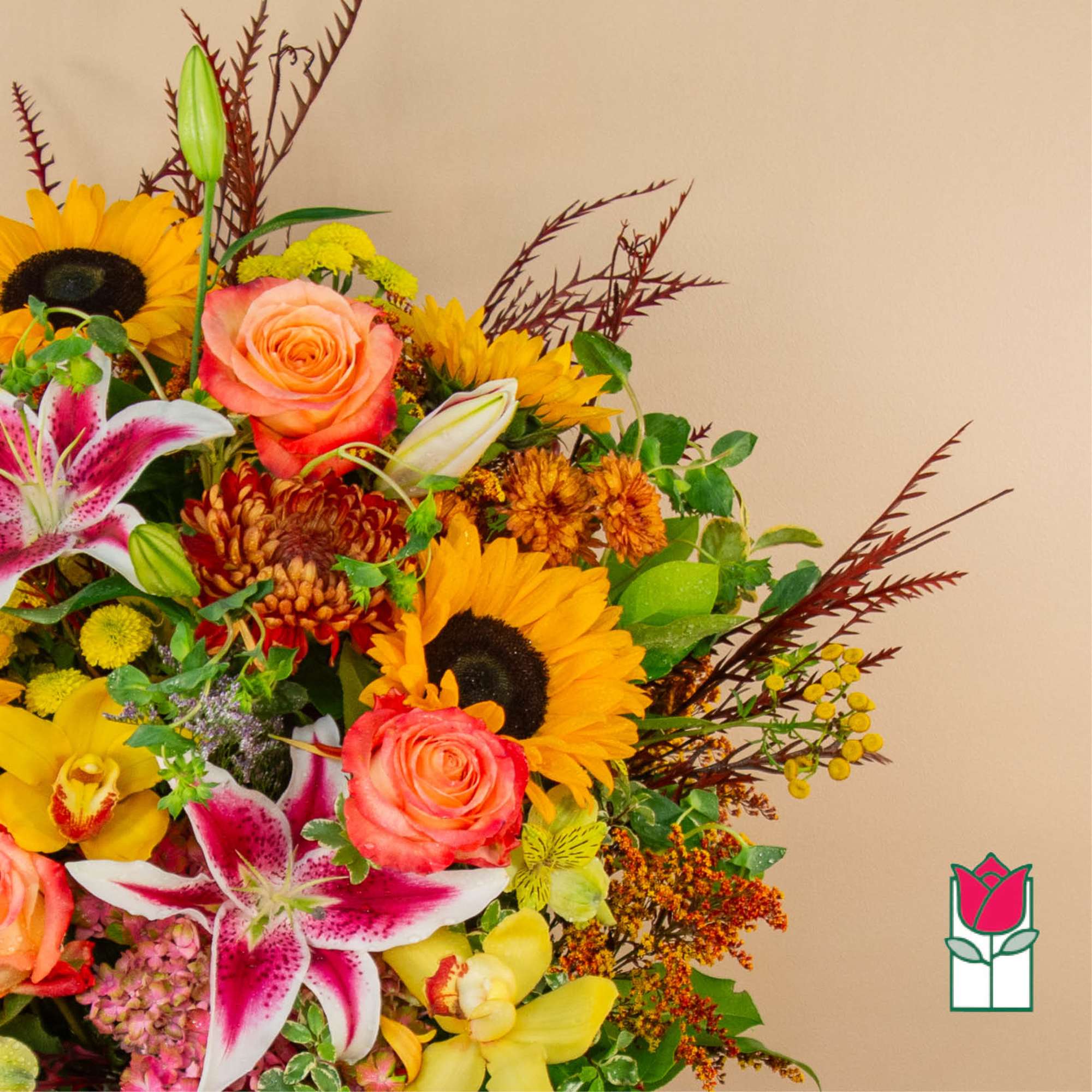 Mixed bouquet with sunflowers, roses, lilies, and orchids