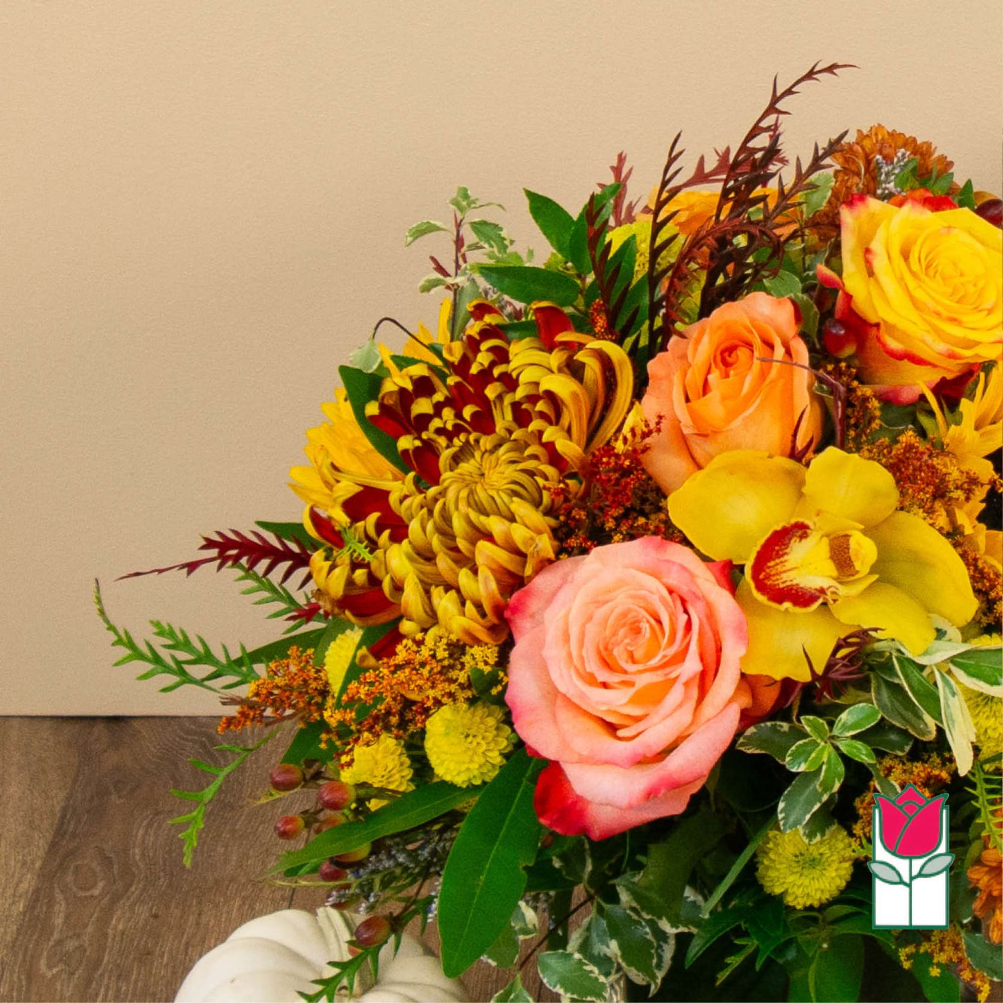 Bouquet of yellow and pink roses with orchids and chrysanthemums