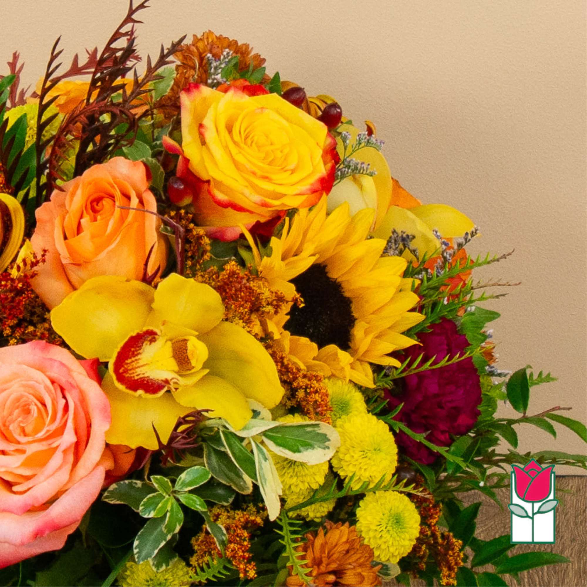 Mixed bouquet with yellow and peach roses, sunflowers, and orchids