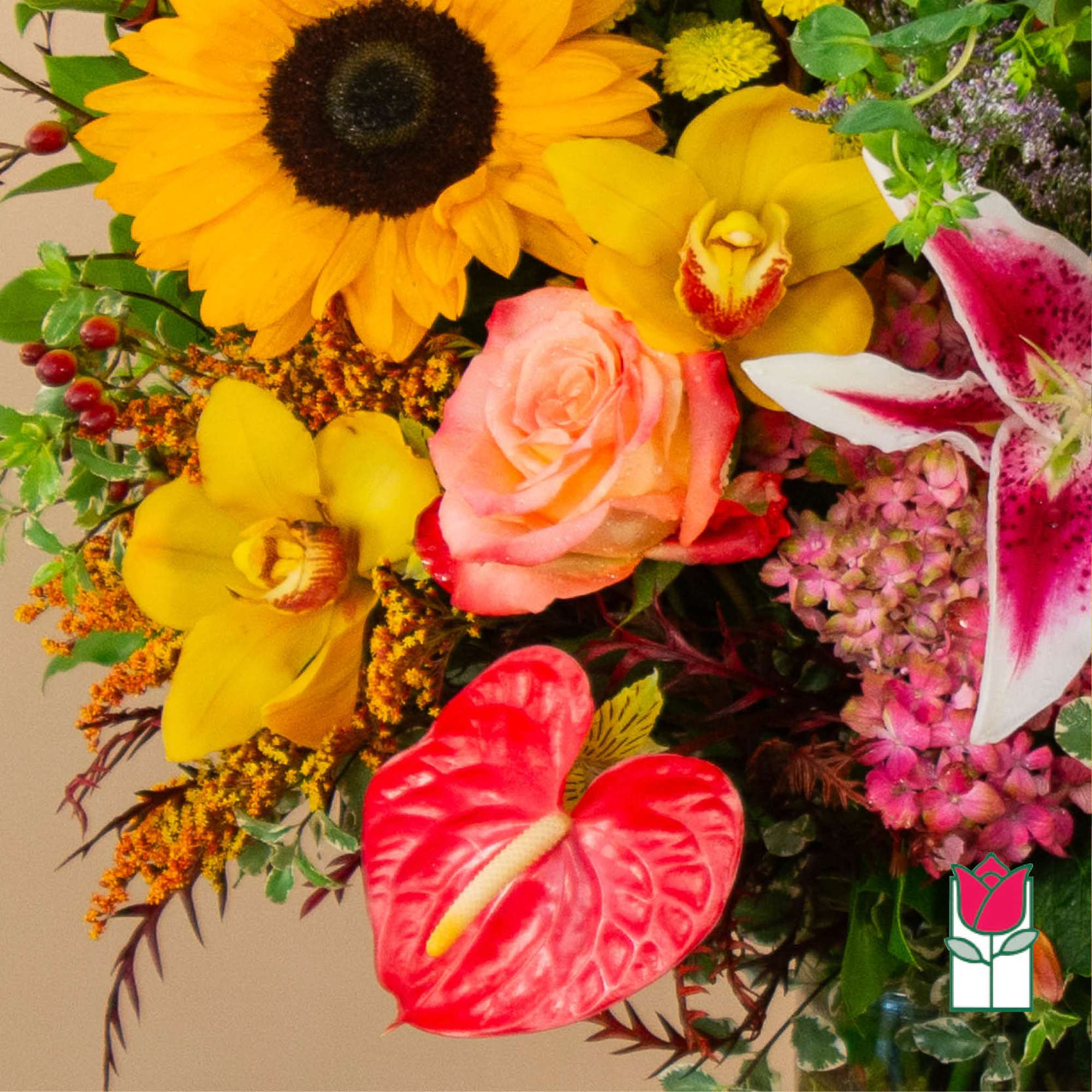 Colorful mixed bouquet with sunflowers, orchids, roses, and anthurium