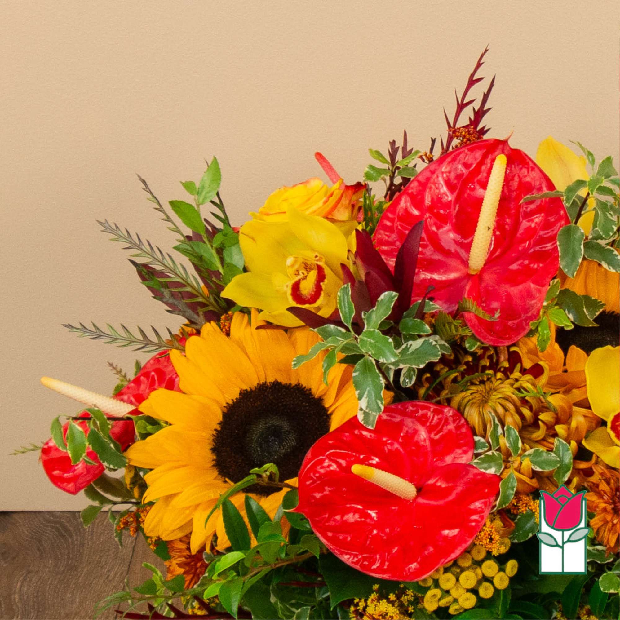 Bright mixed bouquet with sunflowers, red anthuriums, and yellow orchids