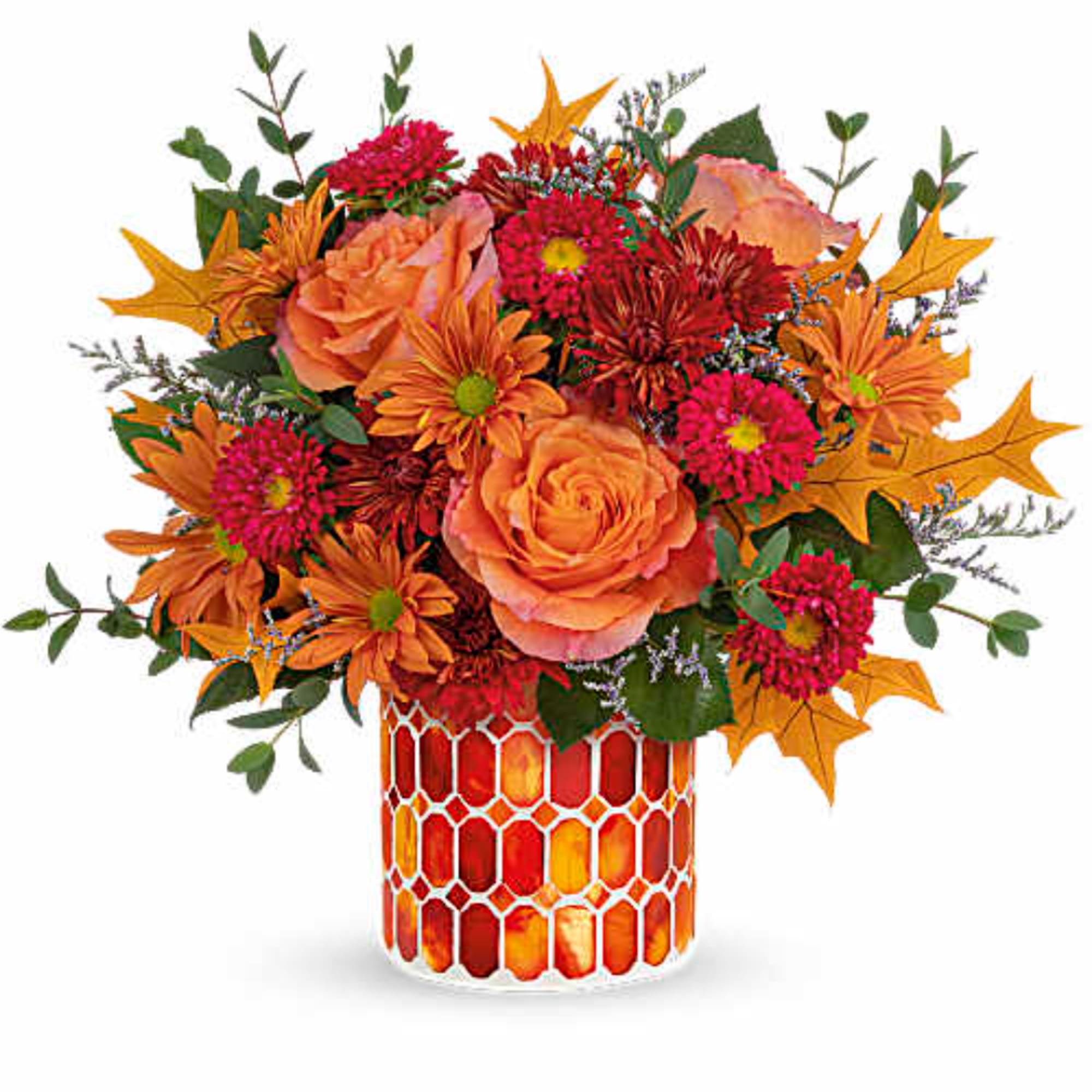 Orange and pink mixed bouquet in a mosaic glass vase