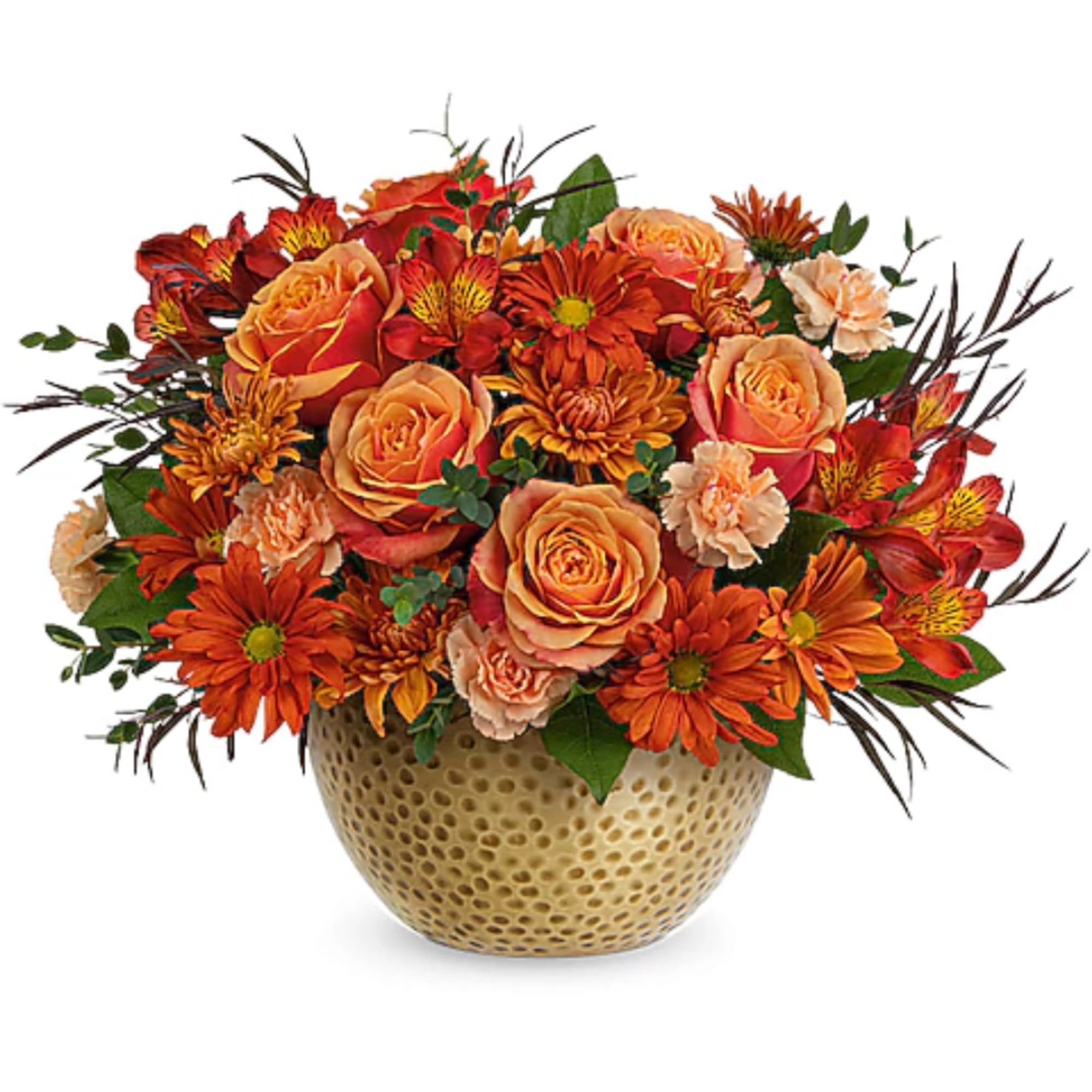 Orange and peach flower arrangement in a textured round vase