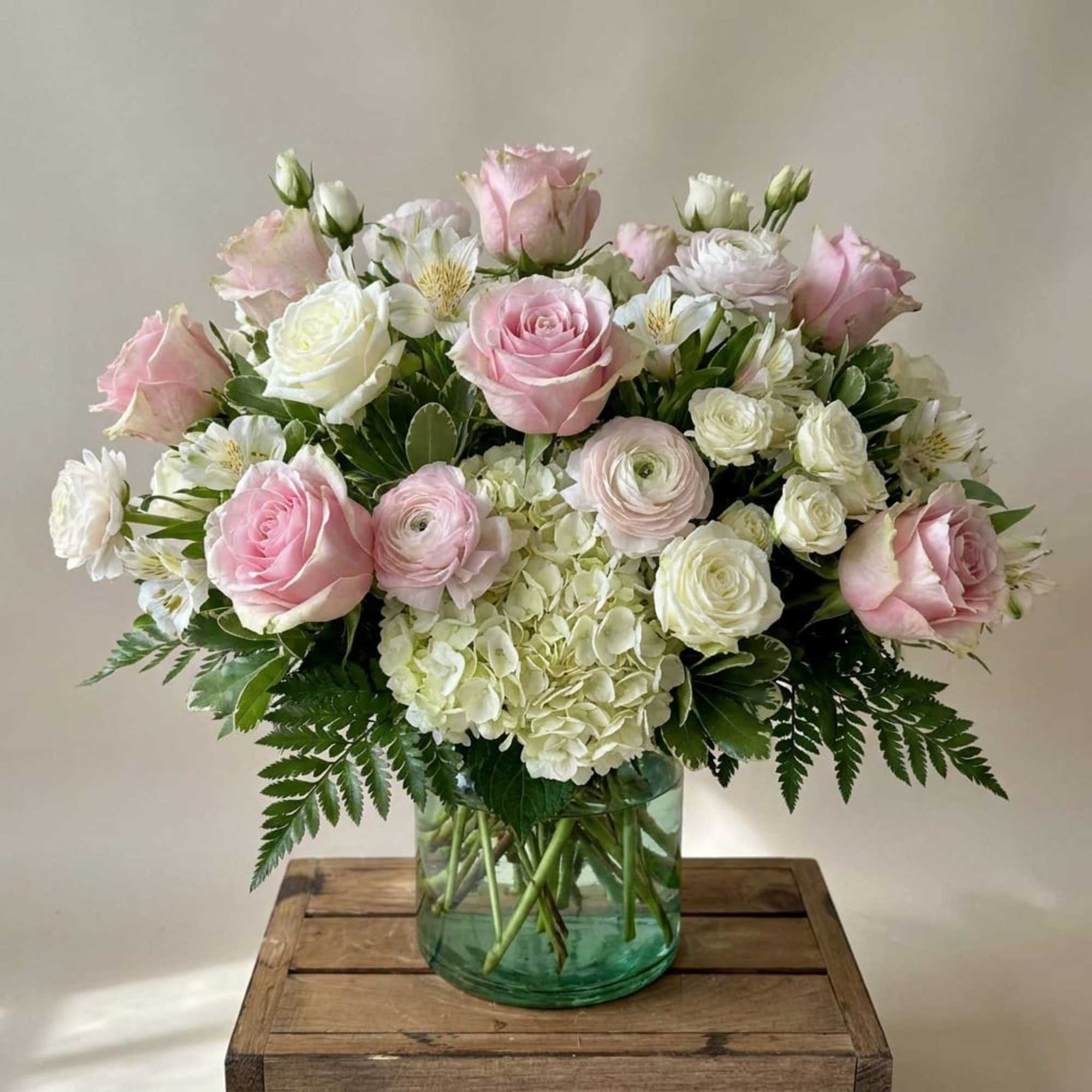 Introducing our Happy Thoughts floral arrangement, a vibrant display of pinks and