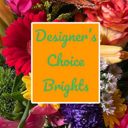 Bright mixed bouquet with gerbera daisies and roses behind a sign