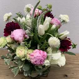 Mixed bouquet with pink peonies, white tulips, and dark burgundy blooms