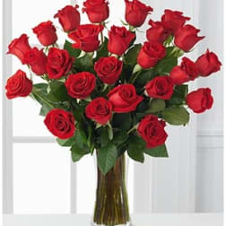 Bouquet of red roses in a clear glass vase