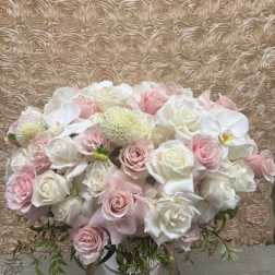 Bouquet of pale pink and white roses with orchids and mums