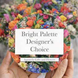 Round card with bright mixed flowers and the text Bright Palette Designer's Choice