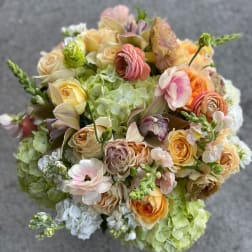 Pastel bouquet of roses, hydrangeas, and mixed blooms